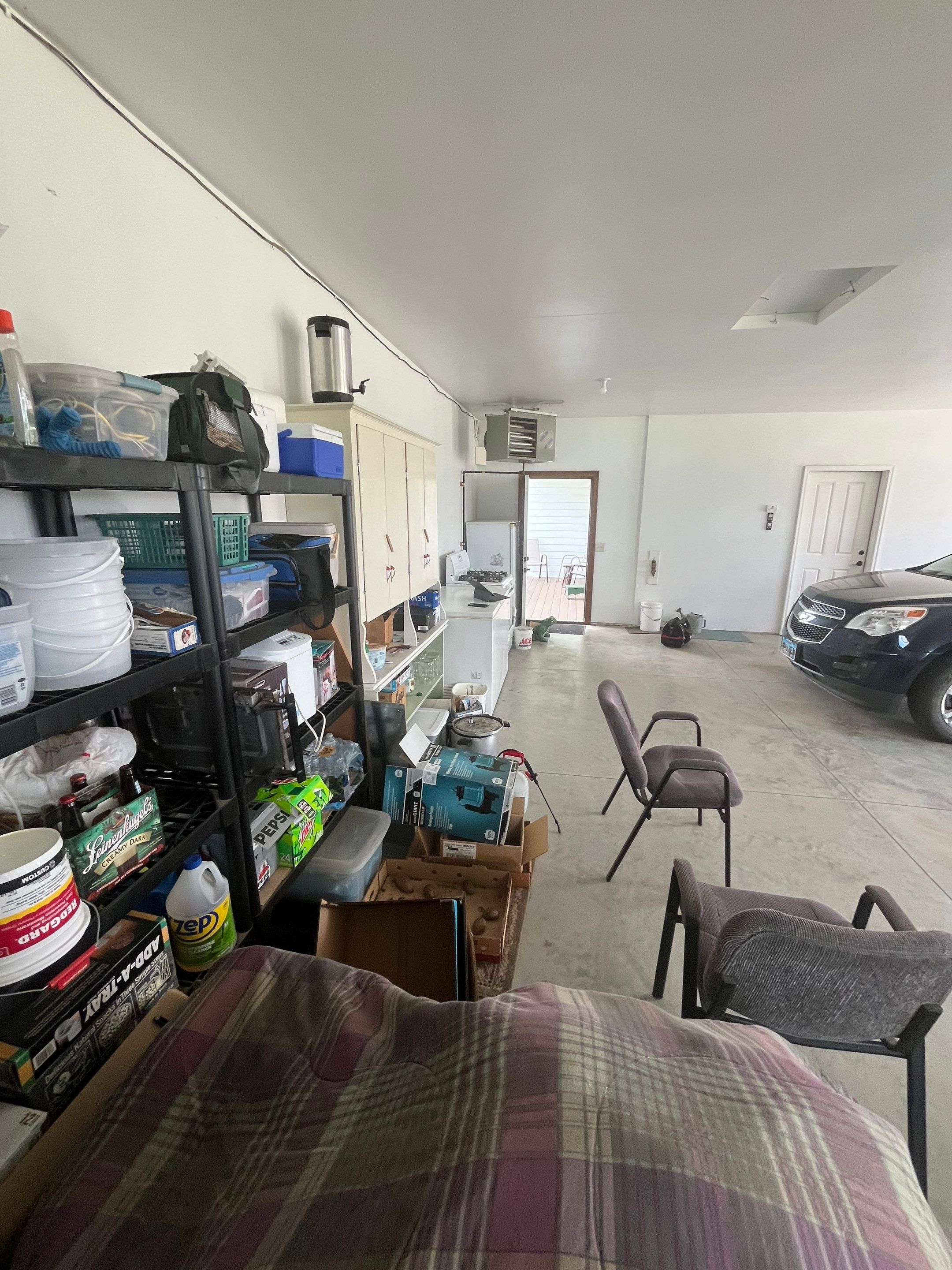 Speckled Epoxy Garage Floor Coating and Concrete Repair in Lennox by Select Painting, Coatings & Garage Cabinets