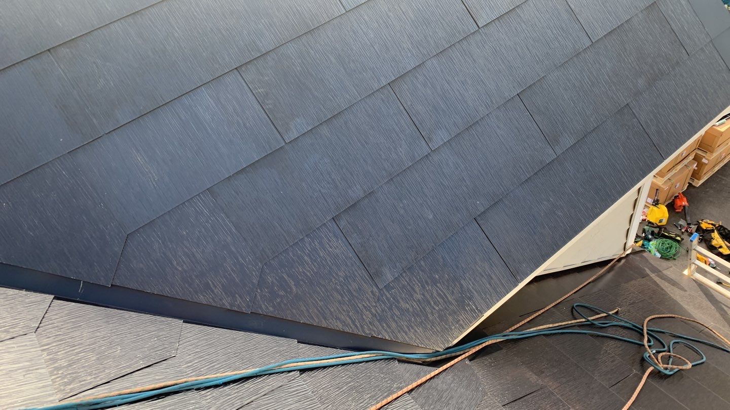 Tesla Solar Roof and Gutter Installation by American Home Contractors