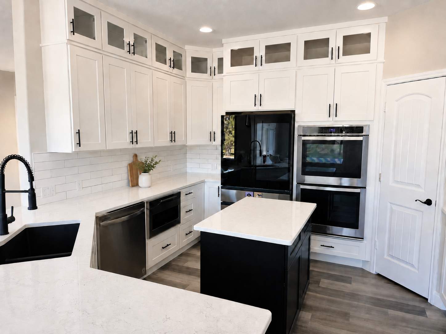 Modern White Kitchen Remodel in San Antonio Featuring Black Range Hood Before and After by Legacy Bath and Kitchen