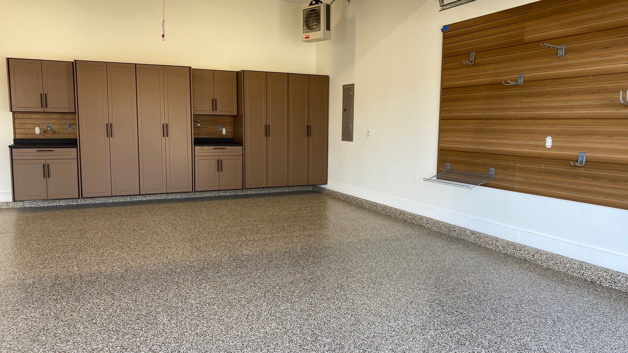 Kenny & Debbie transformed their garage with a Banner Garage Floor and cabinets by Banner Garage
