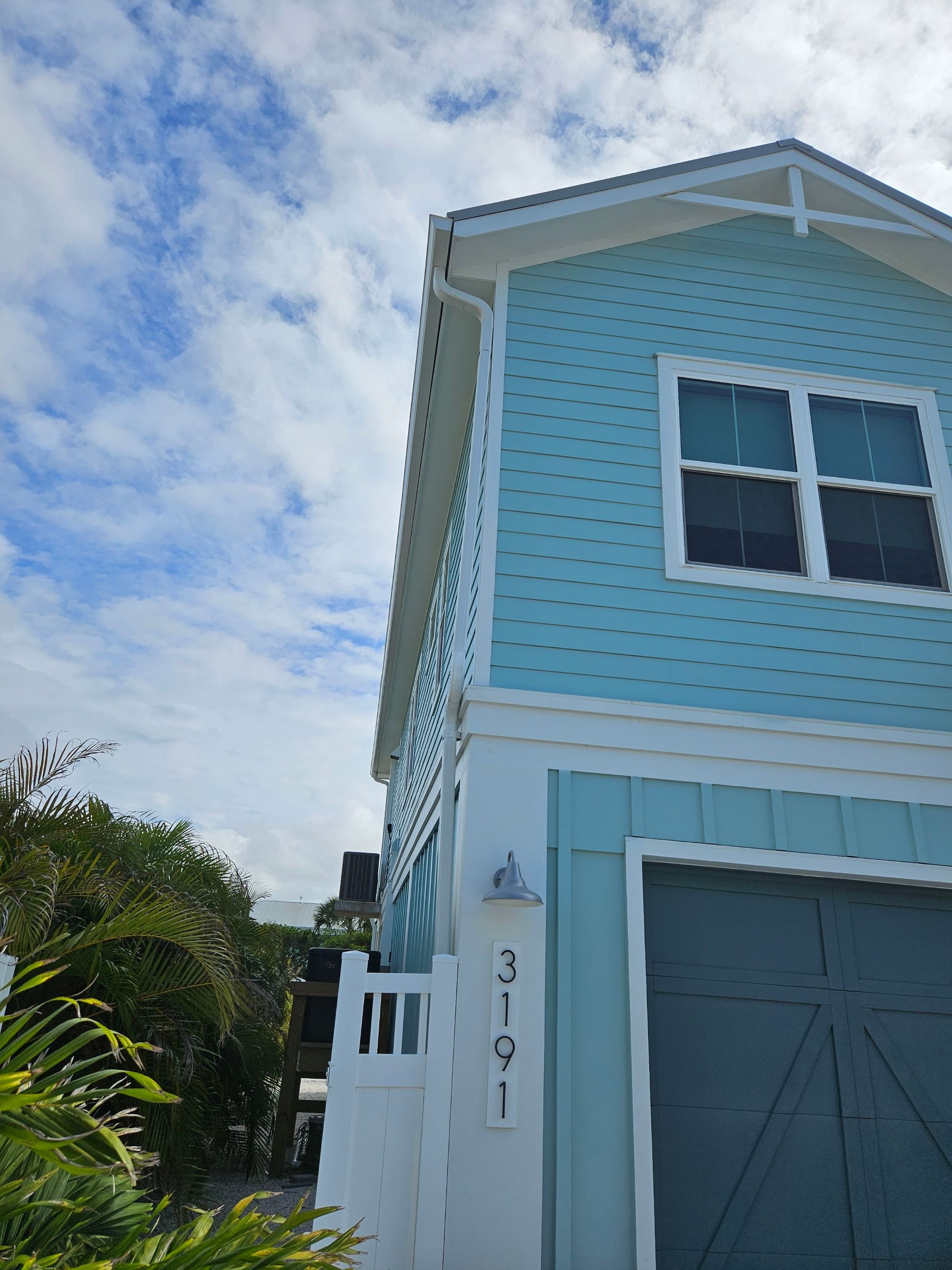 New White Seamless Gutters Installation and Downspouts, Reseal Gutters in Fort Myers Beach, FL  by Gutter Professors