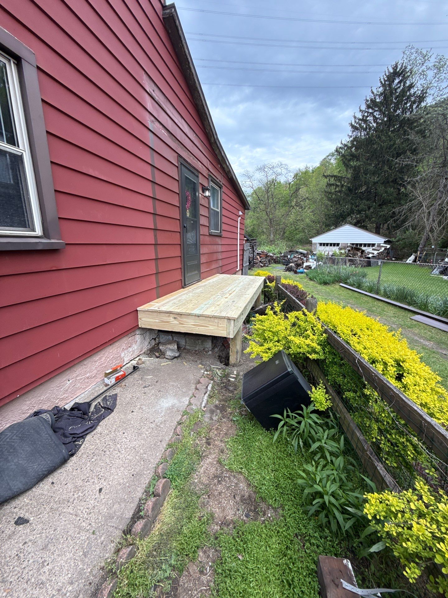 Roof sunspace deck  by Cousins Roofing Siding & Decks