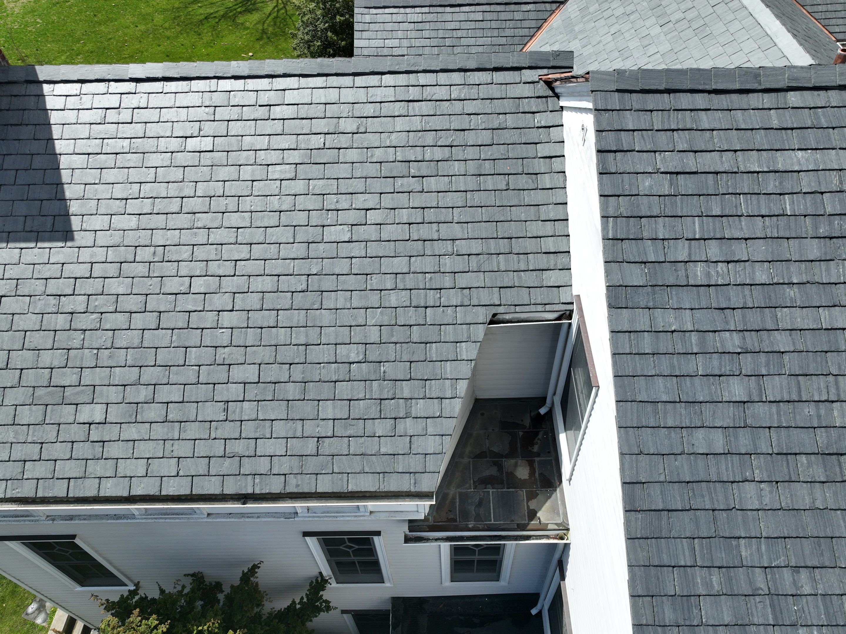 Residential Roofing Installation using Vermont Slate by A Plus Exterior