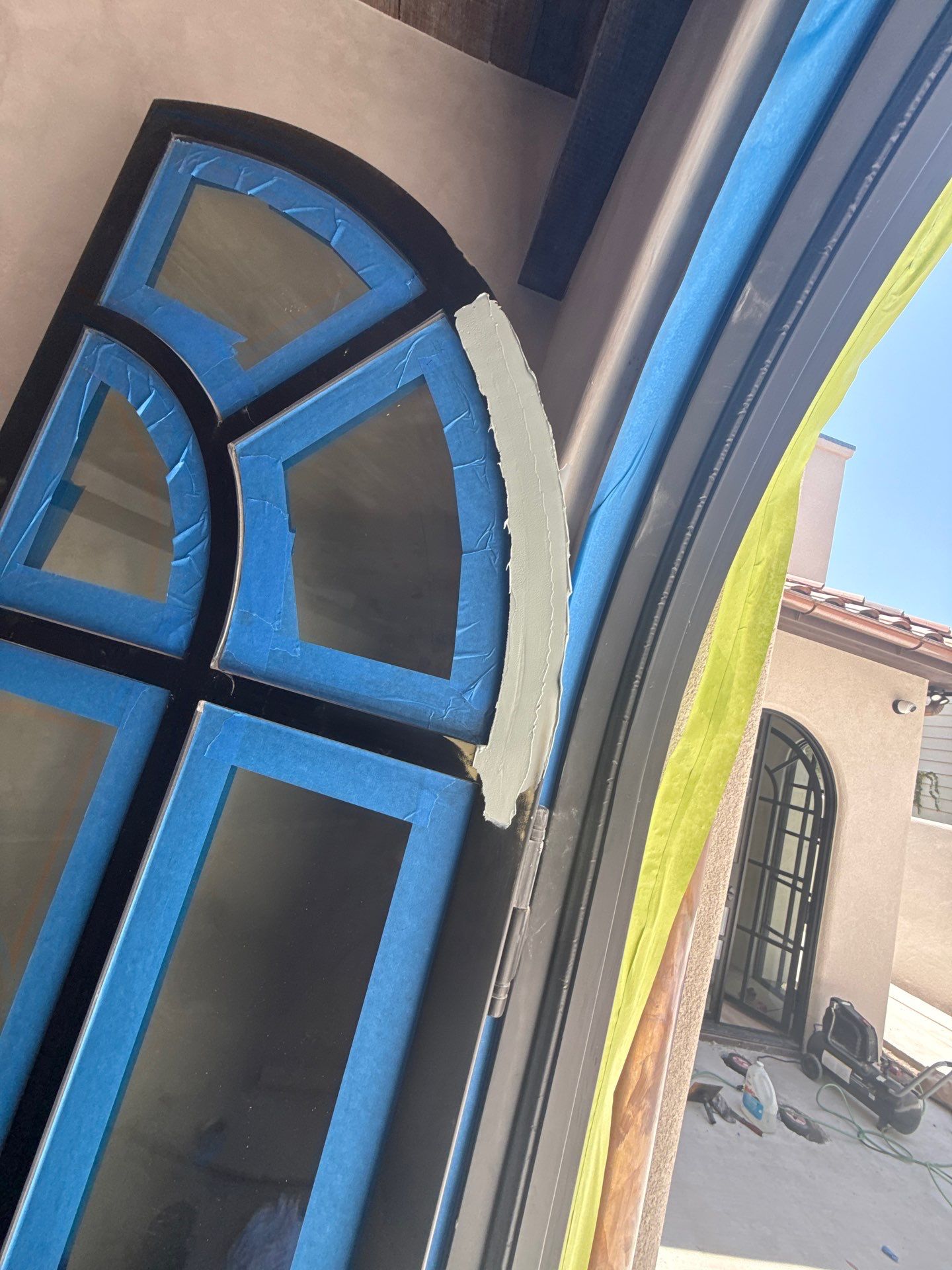 Arched Black Metal French Door Installation and Finishing in Fort Worth by Solara Custom Living