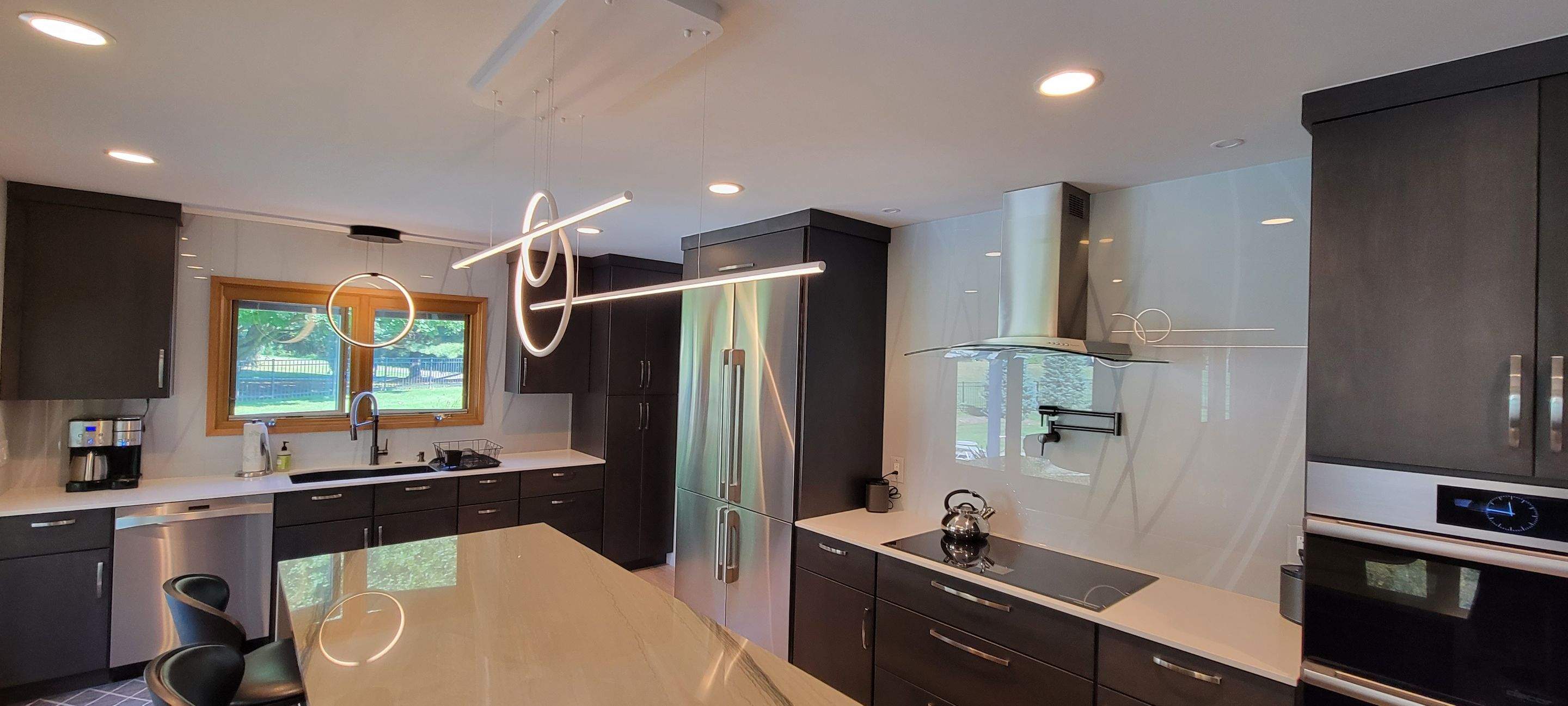 Kitchen Remodel using IMAGIO Misty Curves Solid Glass Backsplash by IMAGIO