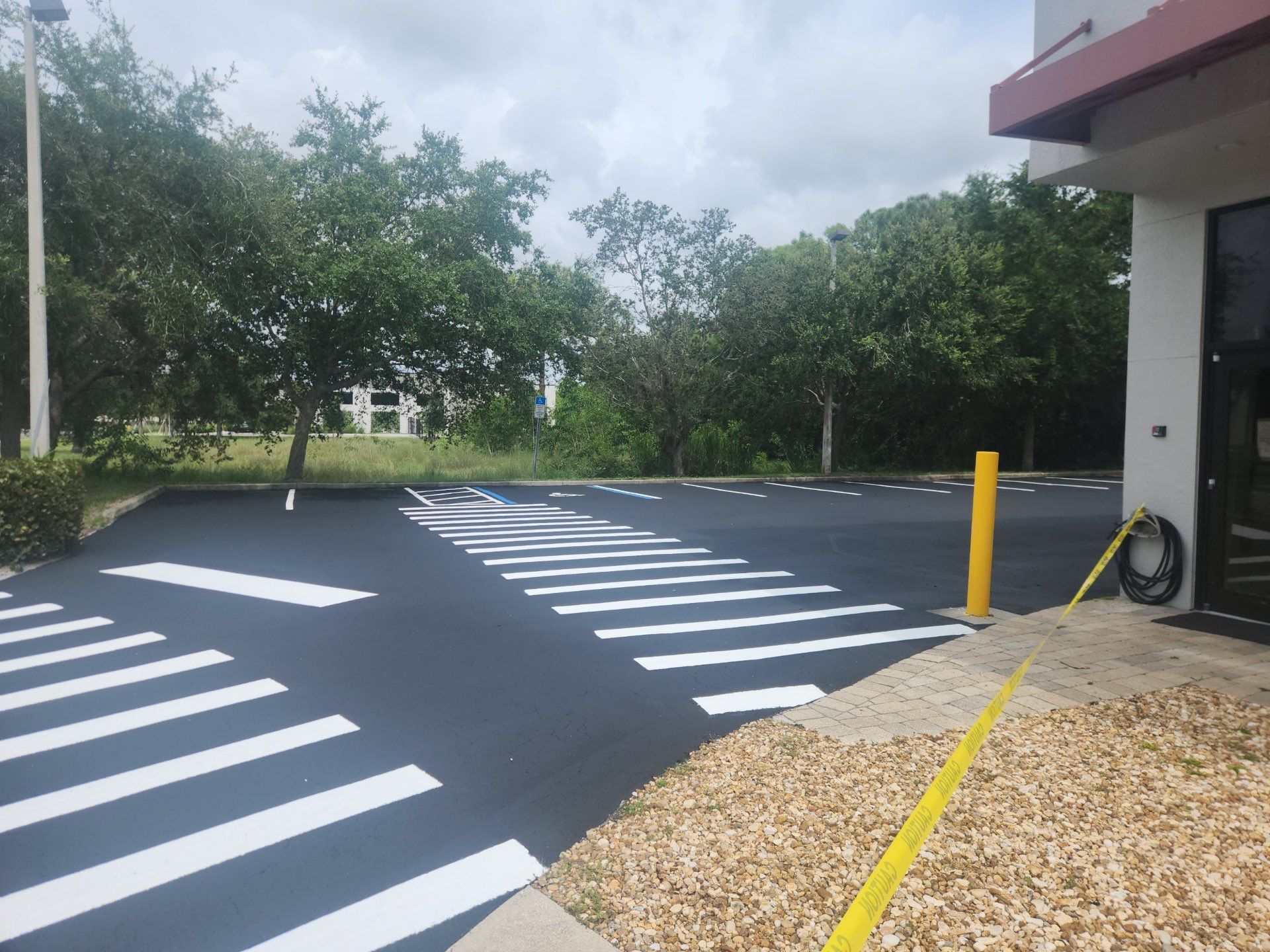 Delivery by Design Gets a Fresh Look: Sealcoating & Striping by Everline Coatings & Services - Southwest FL