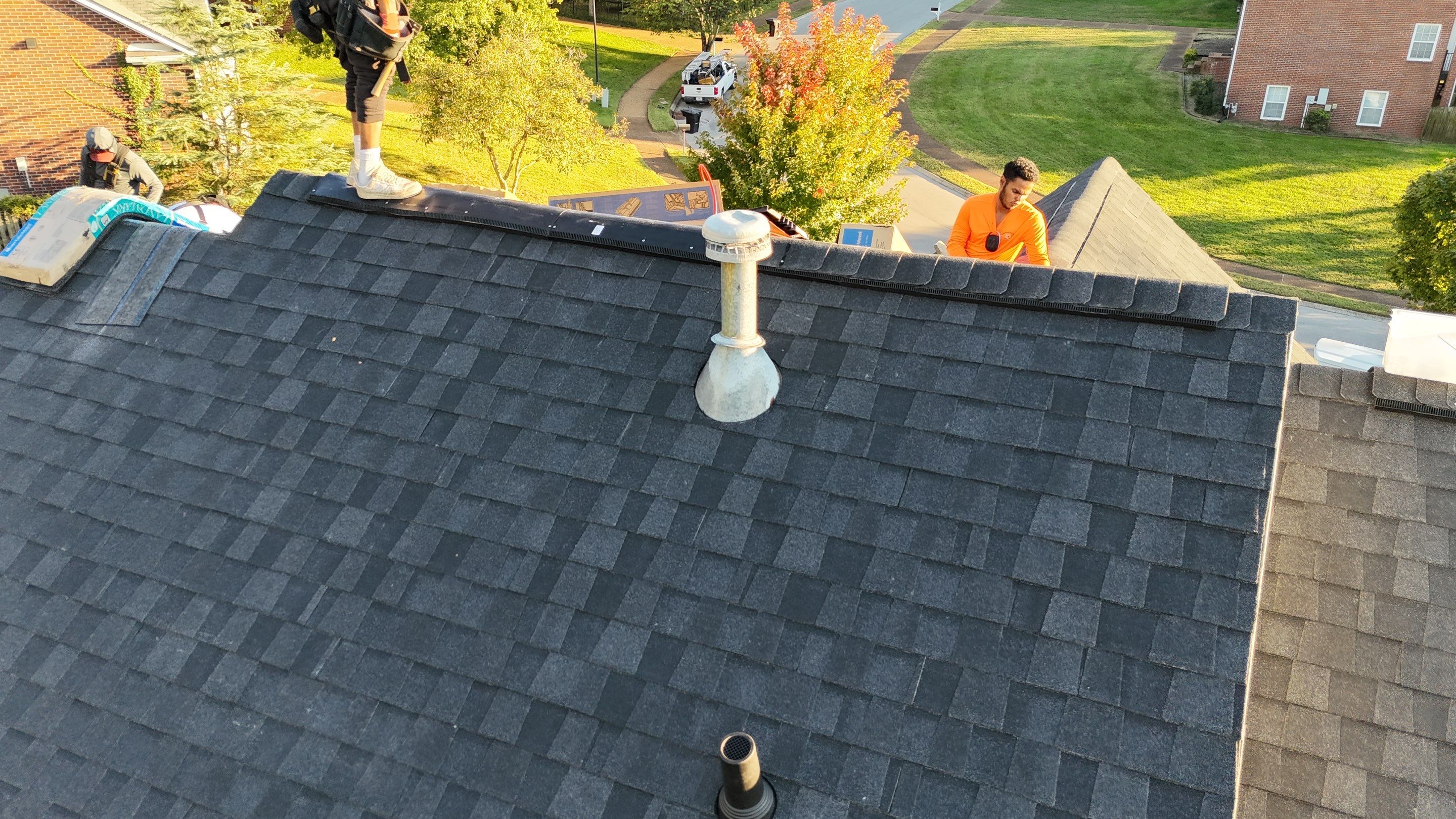 Charcoal Black Re-Roof & Gutters by Royal House LLC