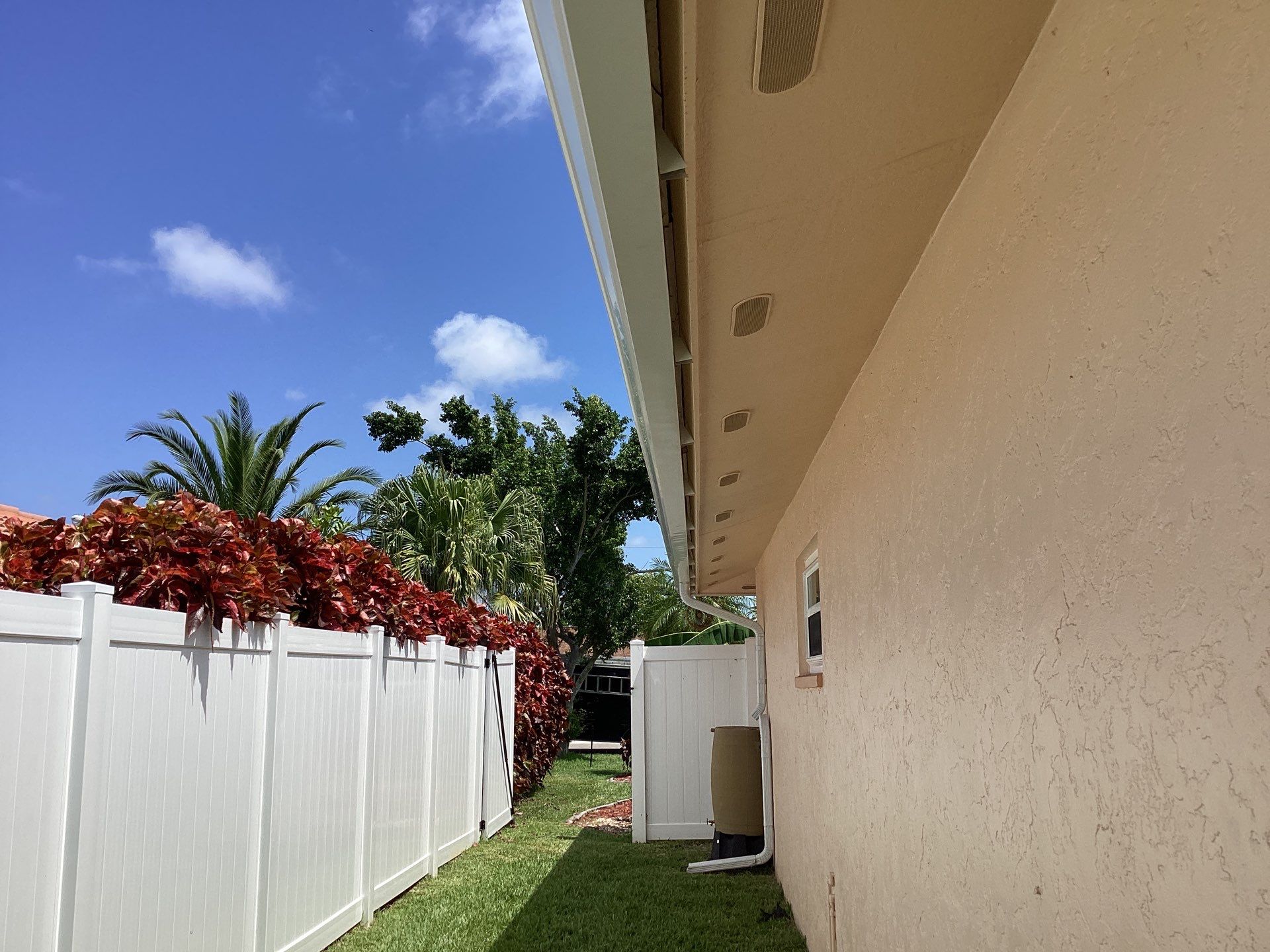 White K Style Seamless Gutters using 3X4 Elbow Downspout in Cape Coral FL by Gutter Professors