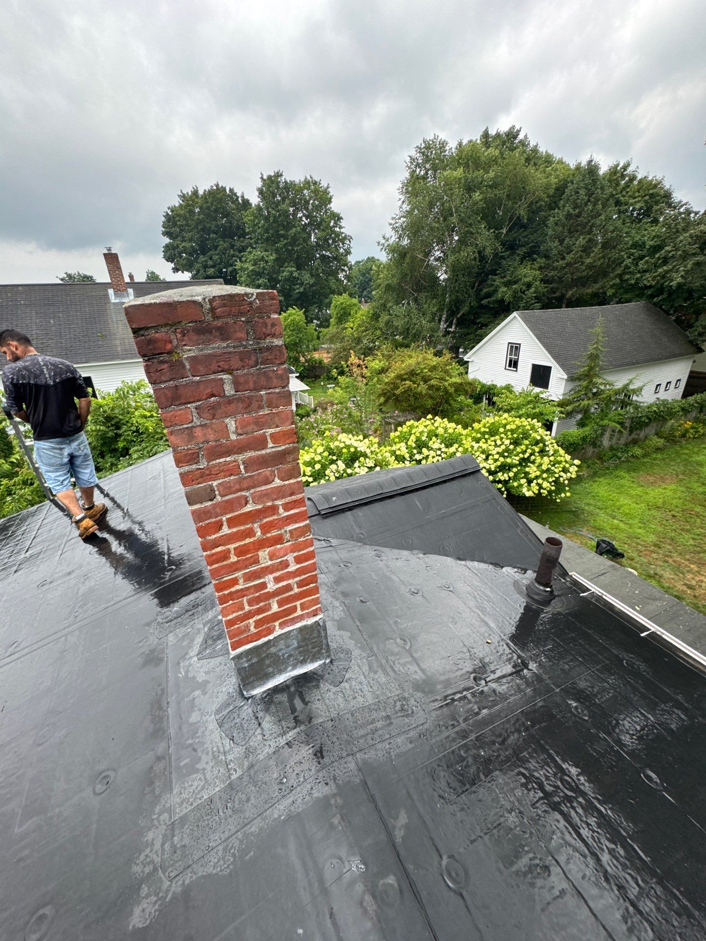 Full Roof Replacement + Custom Gutter Install | Onyx Black Finish by Mighty Dog Roofing of Greater Middlesex County