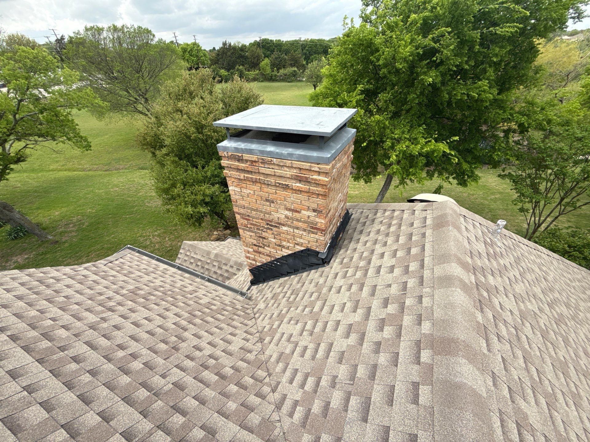 Cricket and Flashing Repair  by Rhino Roofing and General Contracting, LLC