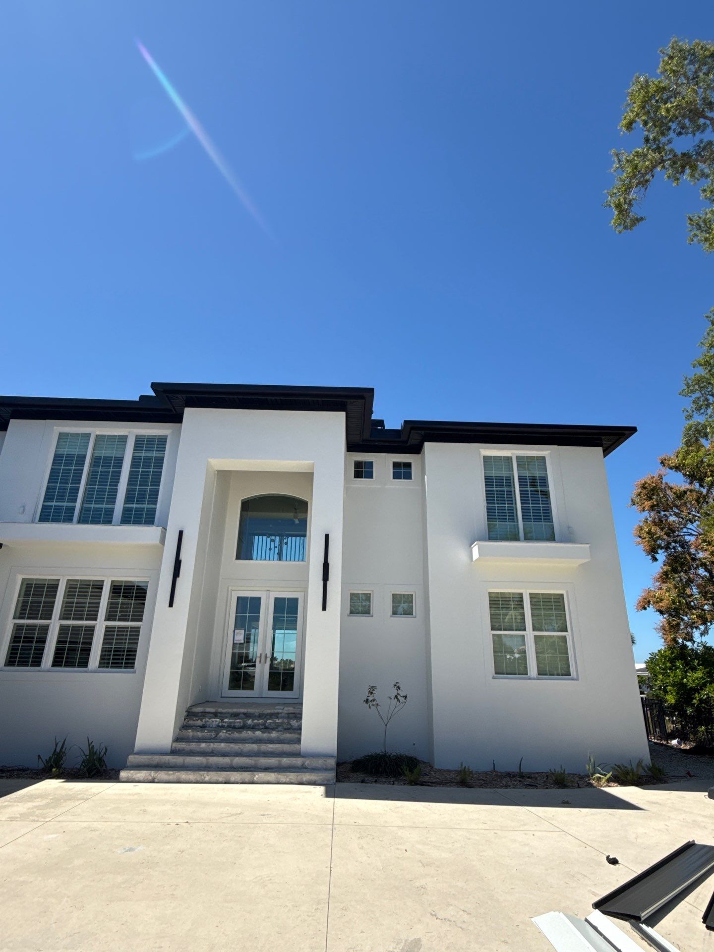 Soffit and Fascia Installation and black seamless gutters in Sarasota FL by Gutter Professors