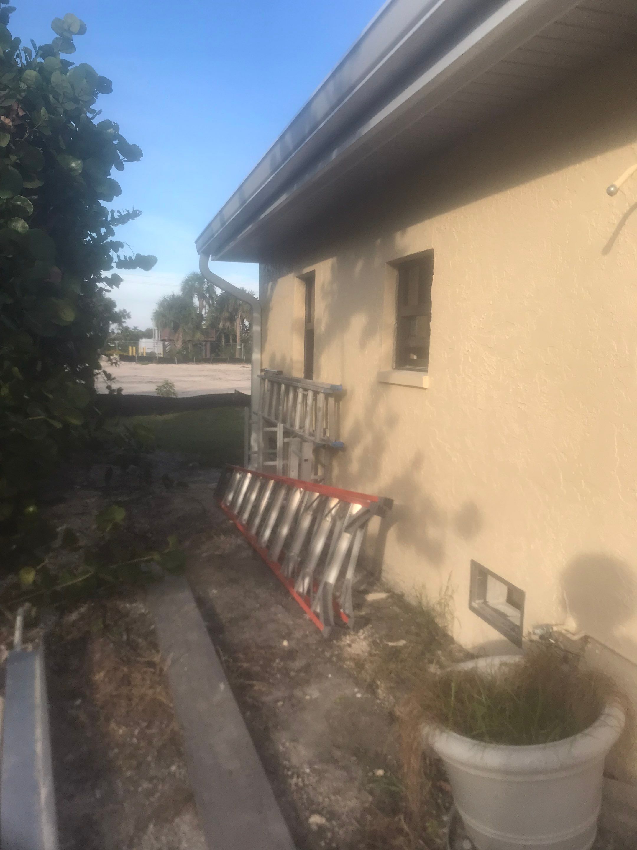 K-Style Seamless Gutter Installation using White Seamless Gutters in Sanibel FL by Gutter Professors