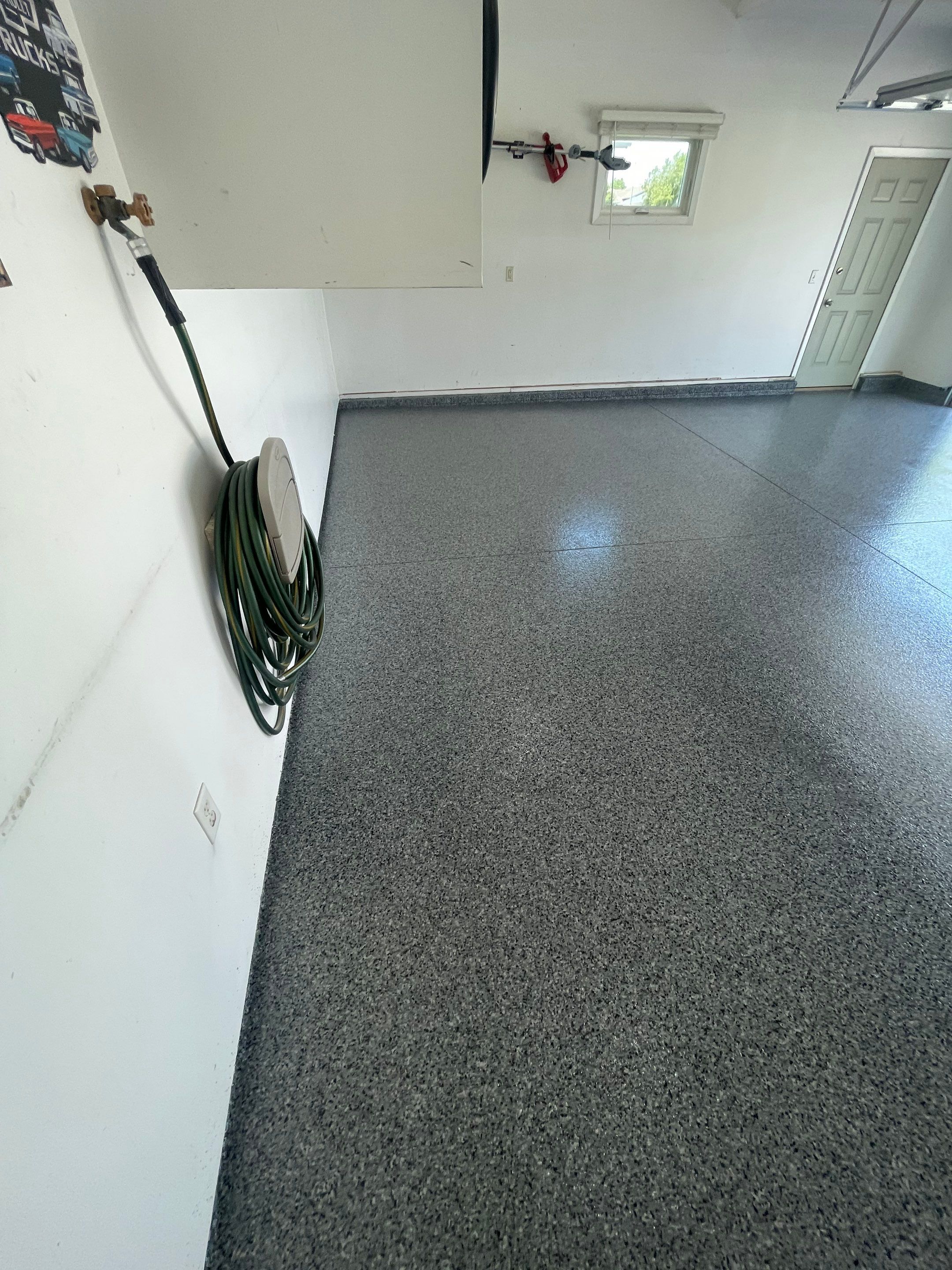 Sioux Falls Garage Floor Coating with Nightfall Decorative Chips by Select Painting, Coatings & Garage Cabinets