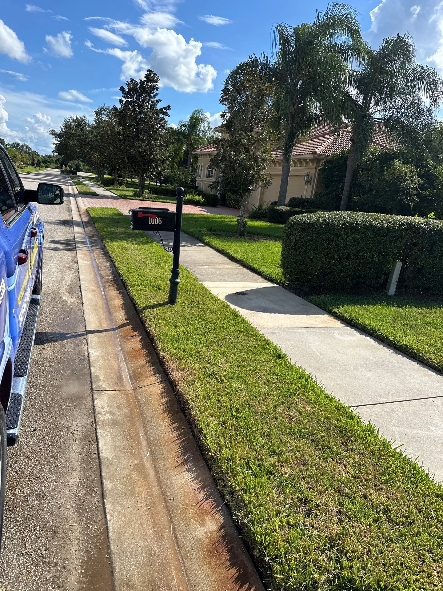 Paver Driveway, Entryway, Sidewalk, and Street Curbing Cleaning in Winding River Community, Bradenton, FL by Sunshine AquaWash