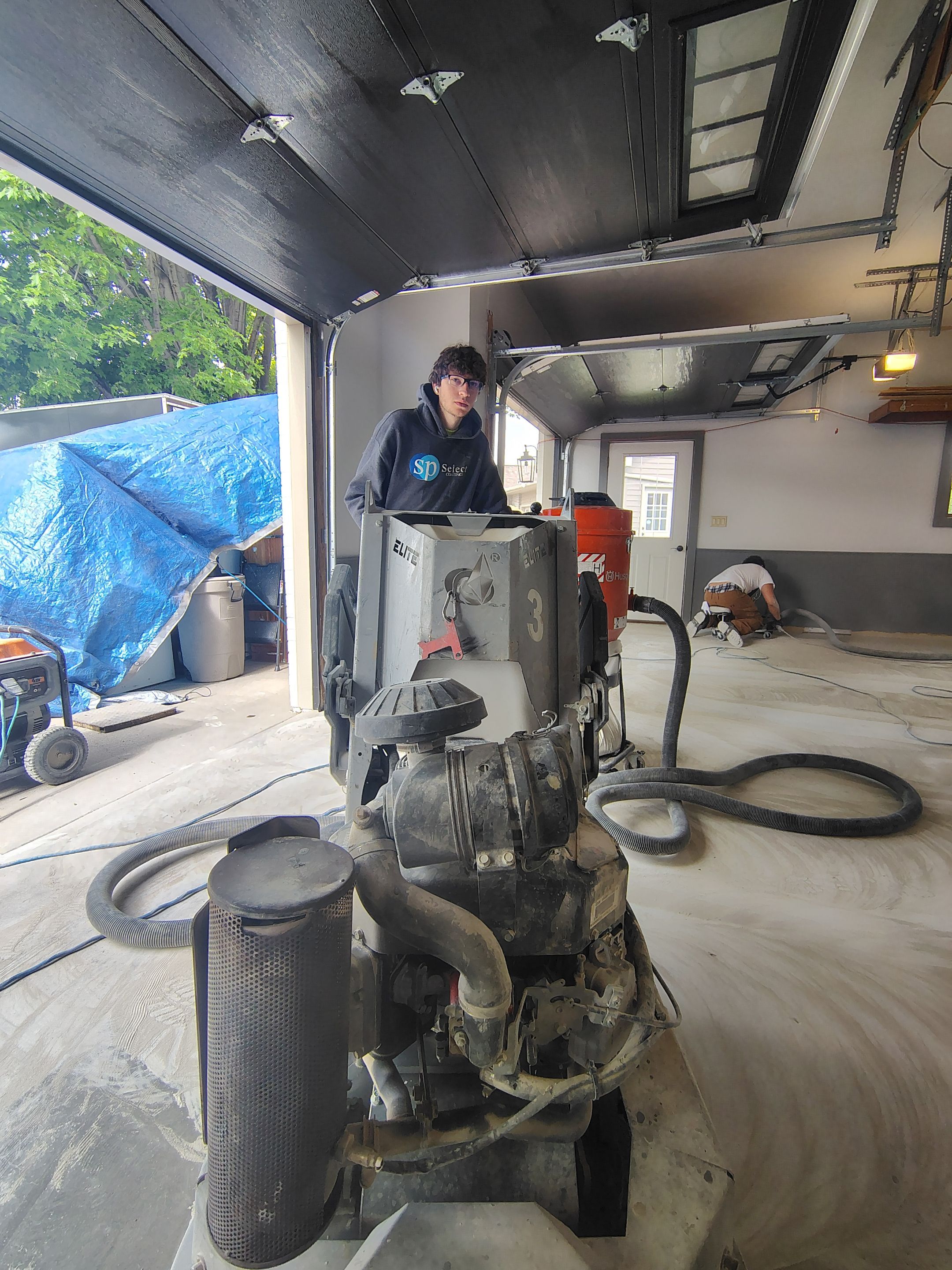 Multi-Fleck Epoxy Garage Floor Coating in Dell Rapids by Select Painting, Coatings & Garage Cabinets