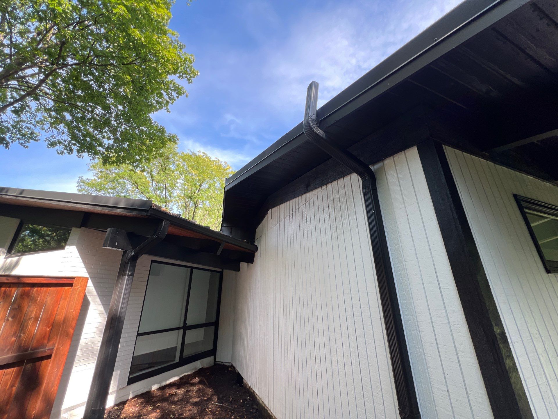 Complete Exterior House, Bluestone & Garage Floor Cleaning by Northern Power Washing LLC.
