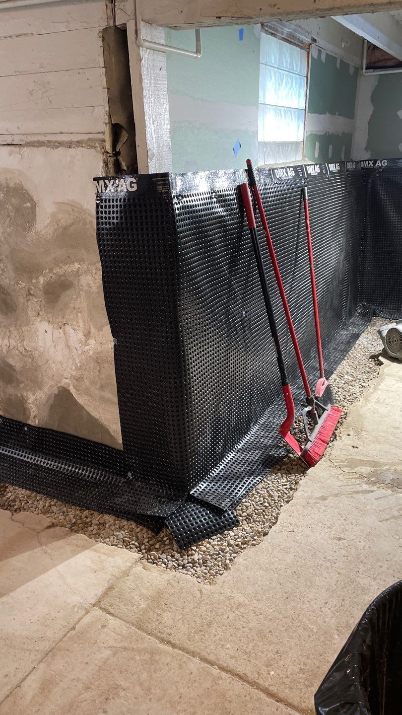 Drain Tile, Window Wells & Buried Discharge in Minneapolis by Waterproofing Northeast