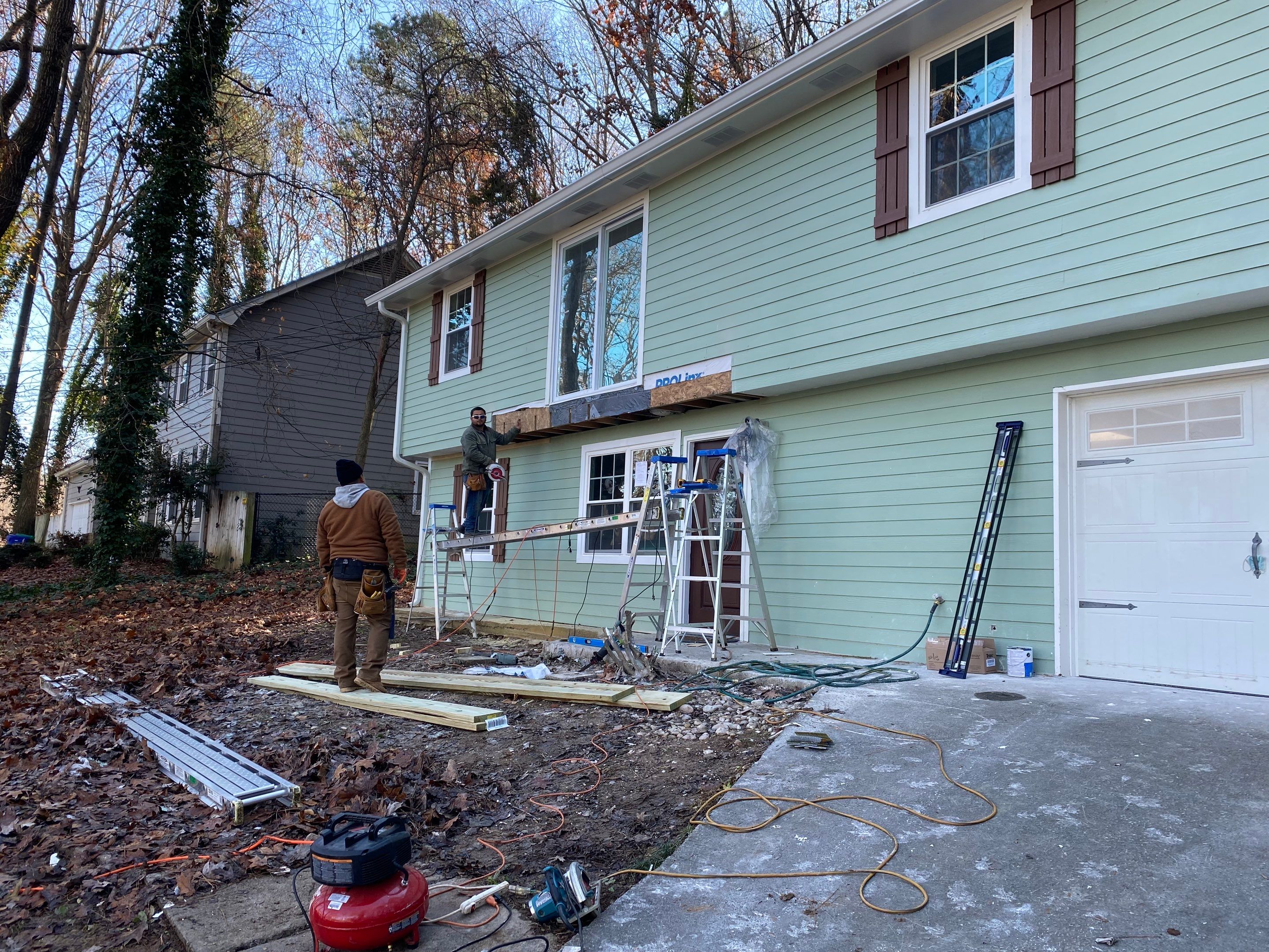 Elevated Wood Deck Construction With Black Metal Railings In Atlanta by Swift Home Renovations