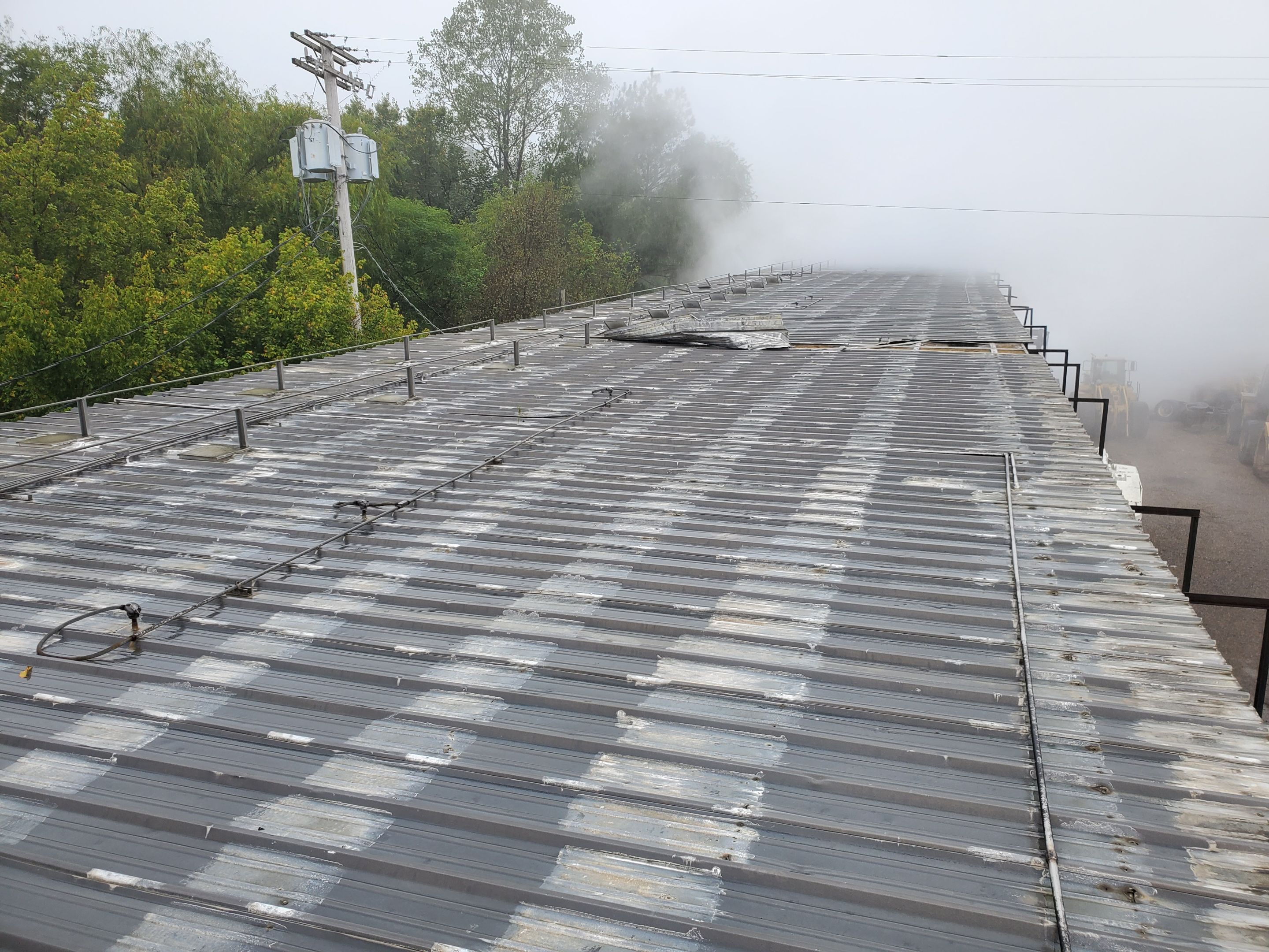 Commercial Roofing Installation using Aluminum Roofing panels by Hostetler Roofing