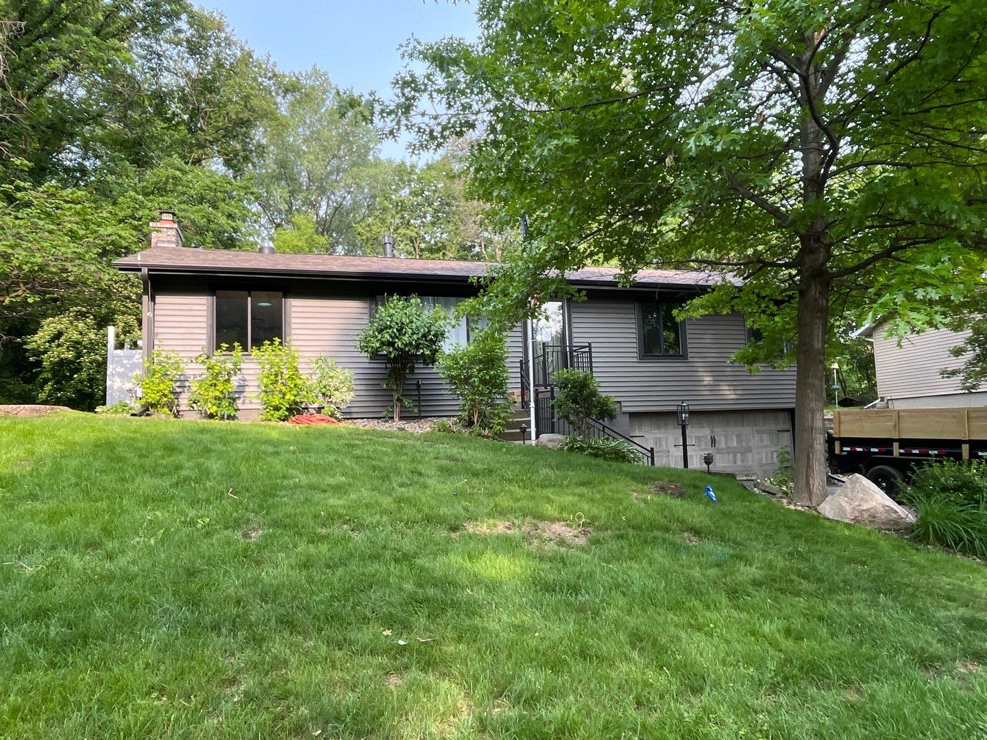 Premium Exterior Remodel – Alside Charter Oak Siding, Hayfield Black Frame Windows, Edco Soffit & Fascia by First Impressions Exteriors