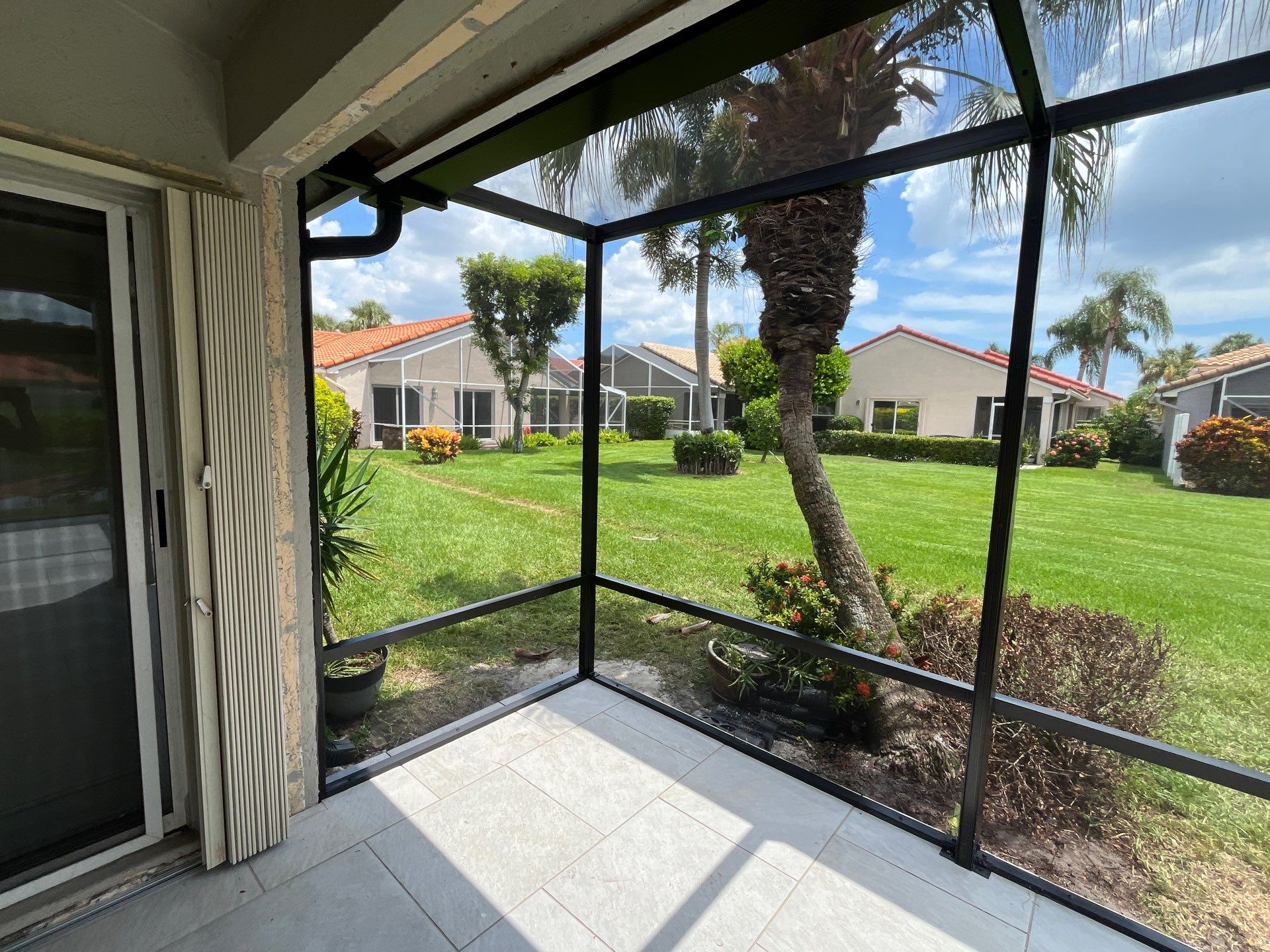 Porcelain Paver Patio and Screen Enclosure Installation in Boynton Beach by The Screen Depot, Inc