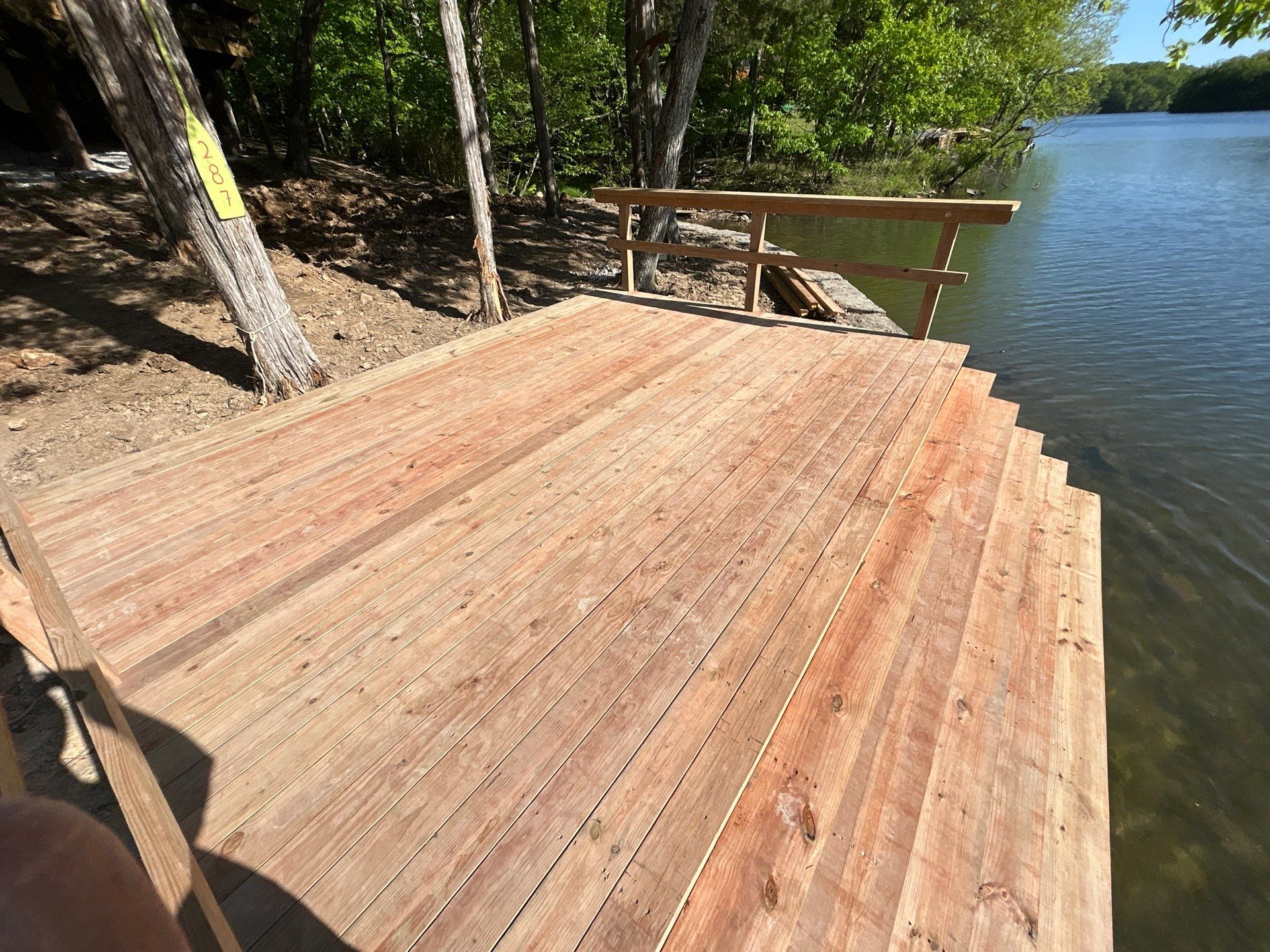 Lakeside Deck & Fire Pit by Loch Ness Landscaping, LLC