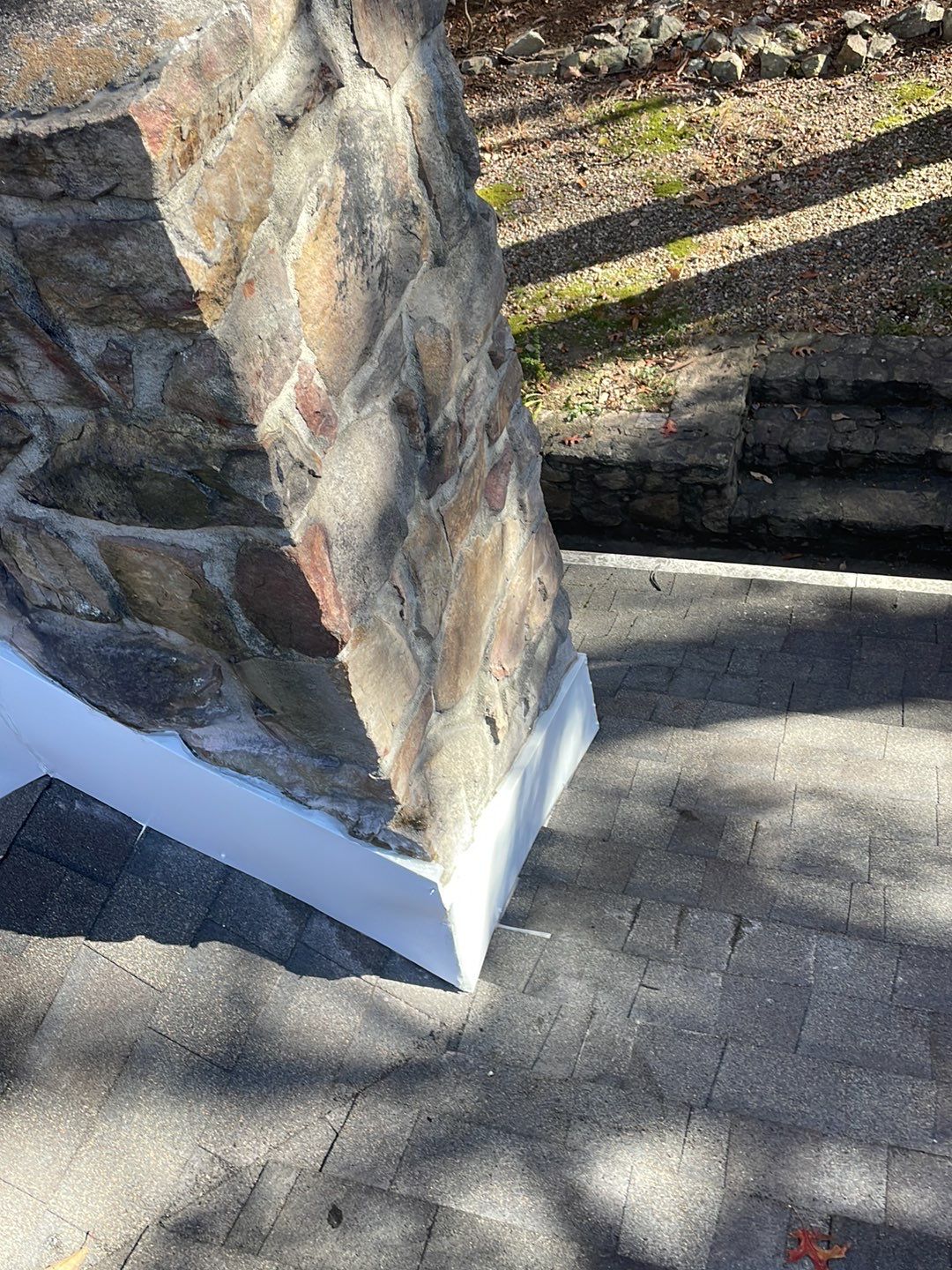 Insurance repair and chimney saddle installation. by Teflon Roofing