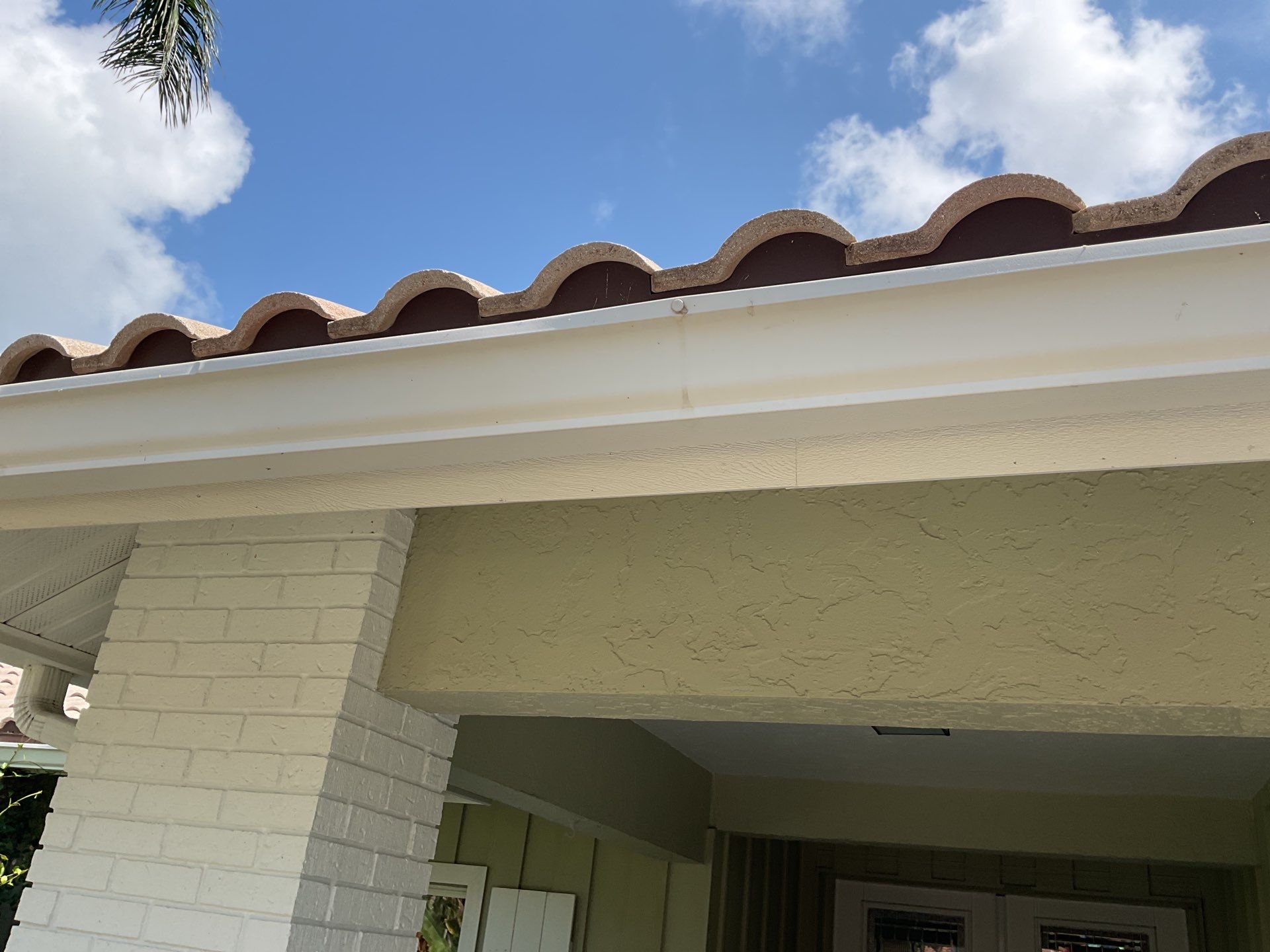 White Gutter Installation in Sarasota FL by Gutter Professors