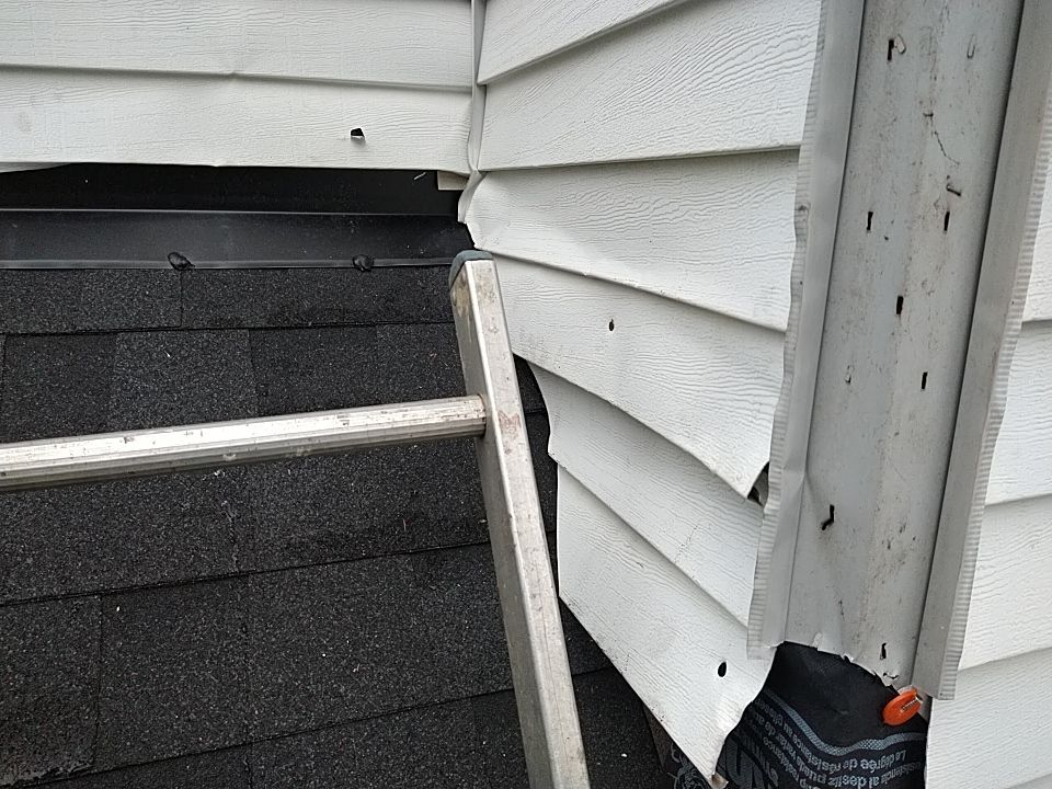 James Hardie Siding  using James Hardie Board and Batten, White by Absolute Roofing and Construction