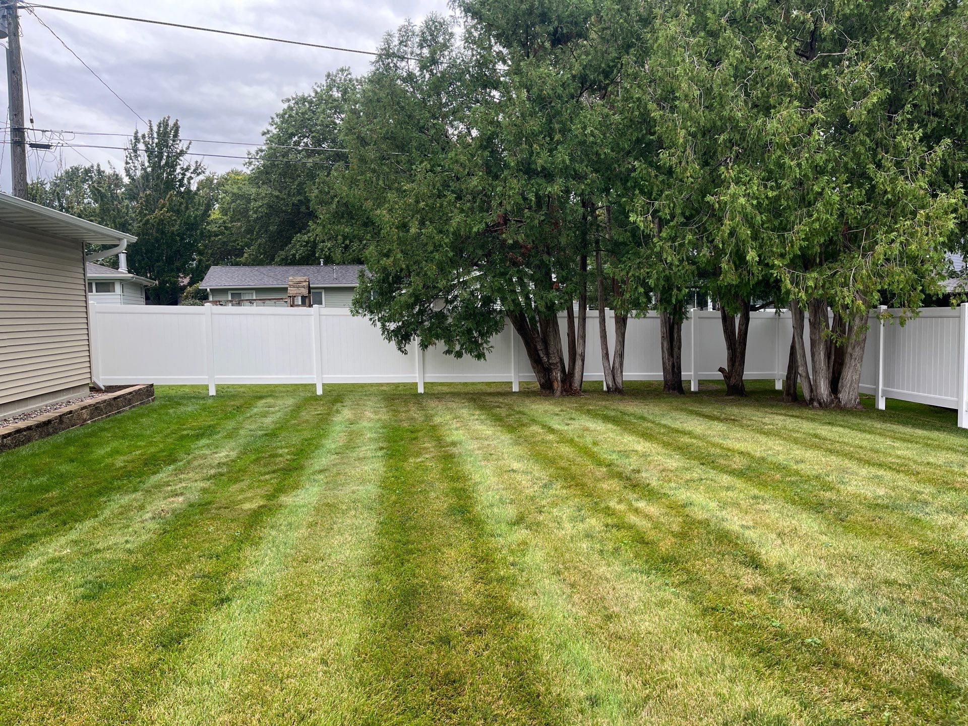 Residential White Vinyl Privacy Fence Enclosure in Waterloo by Perfect Picket Fence and Stain