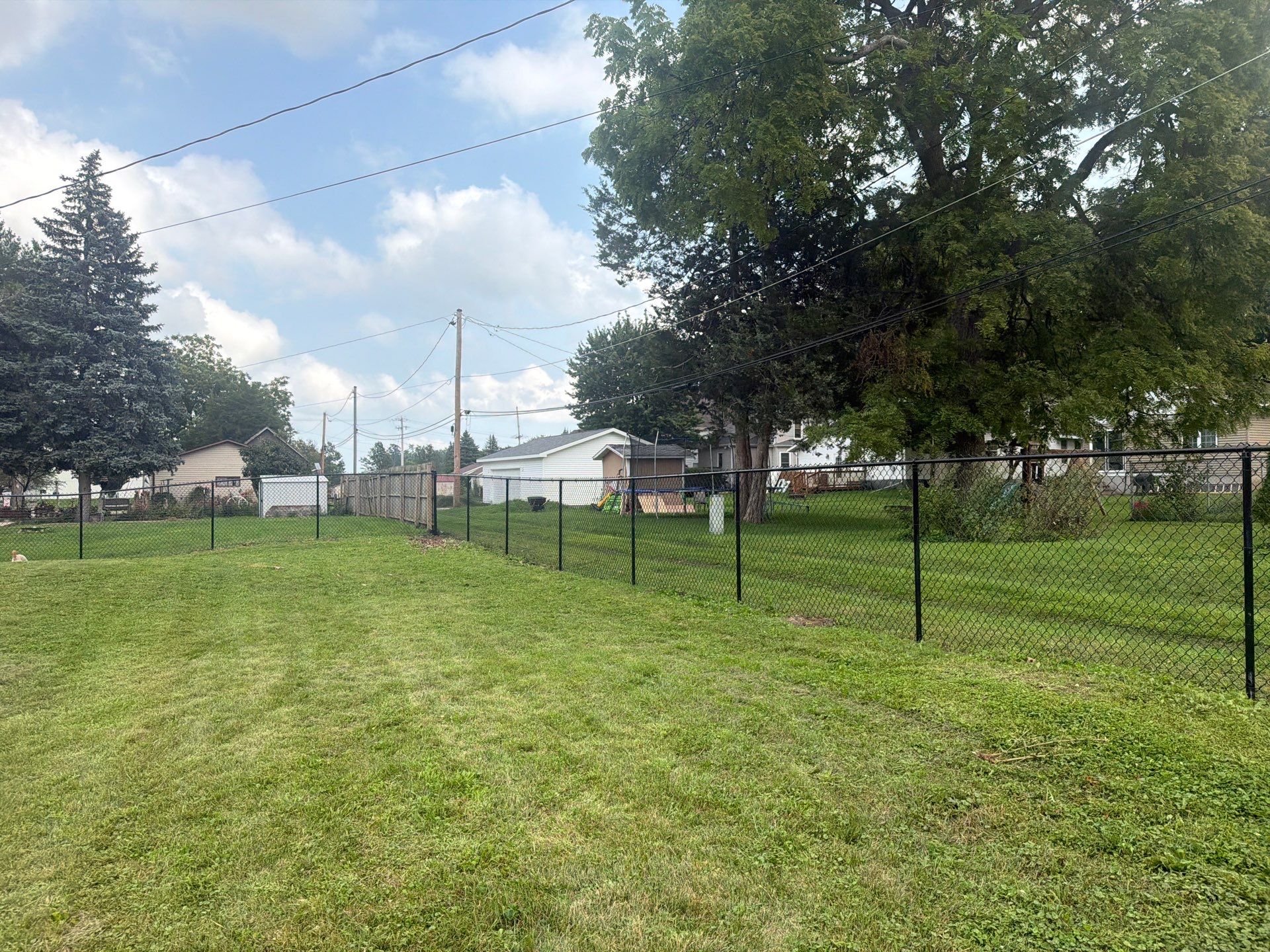 Residential Black Chain Link Fence Installation in Reinbeck by Perfect Picket Fence and Stain