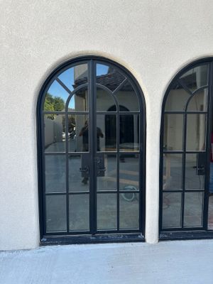 Arched Black Metal French Door Installation and Finishing in Fort Worth