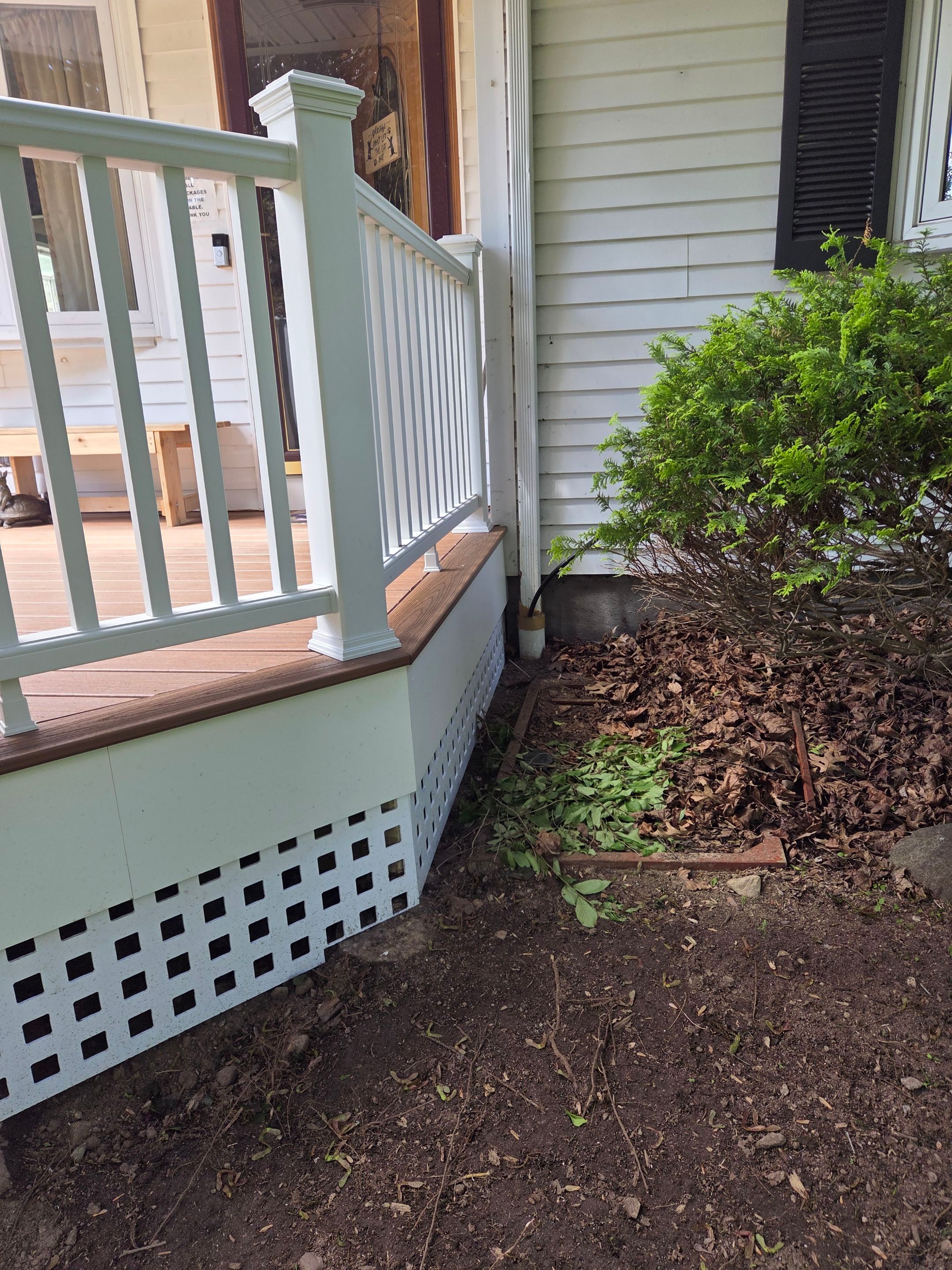 Deck Replacement, Trex Tiki torch boards, with White composite railing and lattice. by DiGiorgi Roofing and Siding Inc