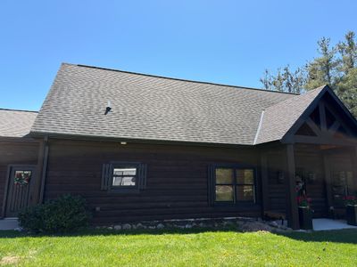 Seamless Gutter Installation for Log Sided Home in Harbor Springs