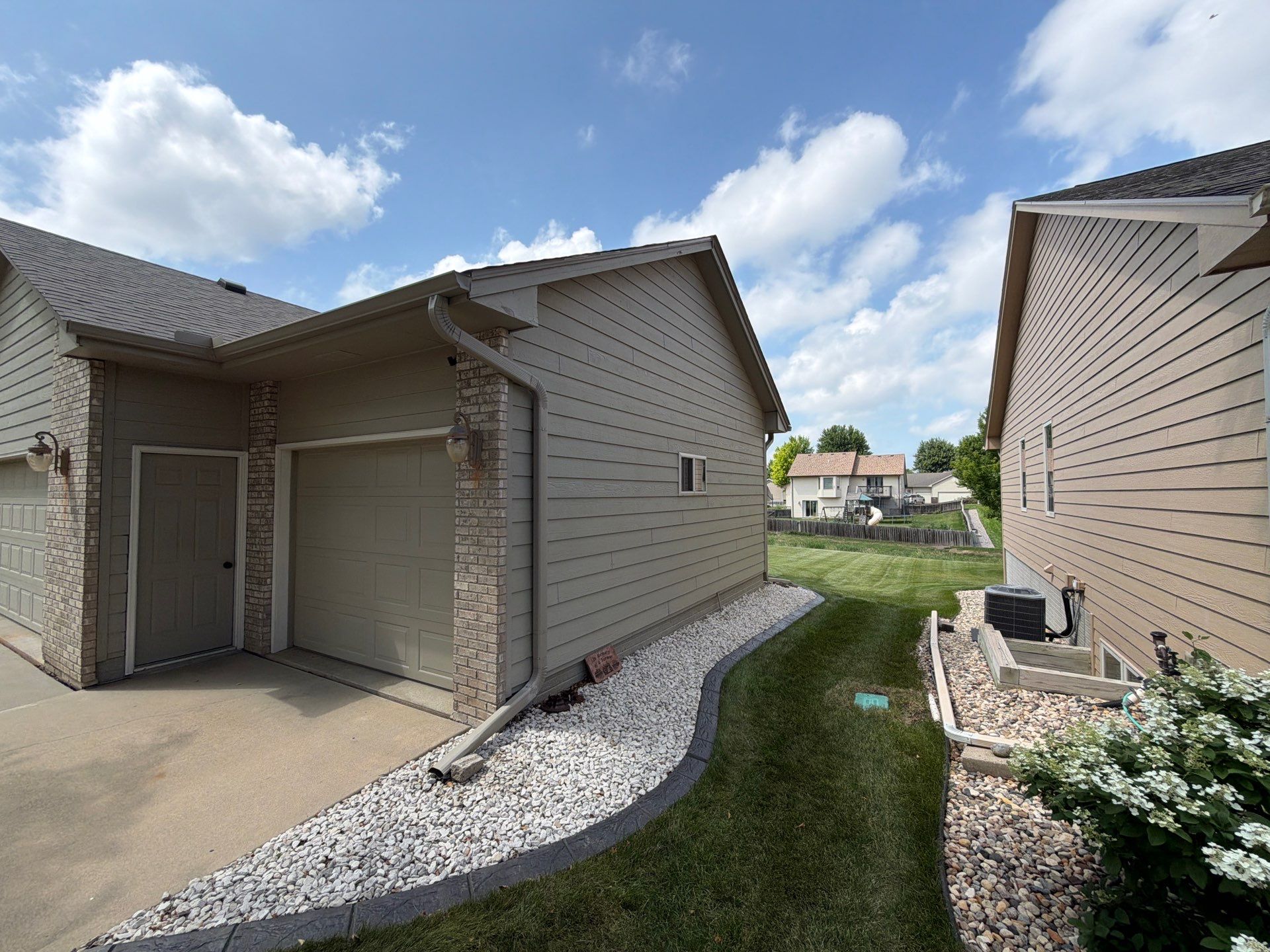 Residential Exterior Painting and Siding Refresh in Sioux Falls by Select Painting, Coatings & Garage Cabinets