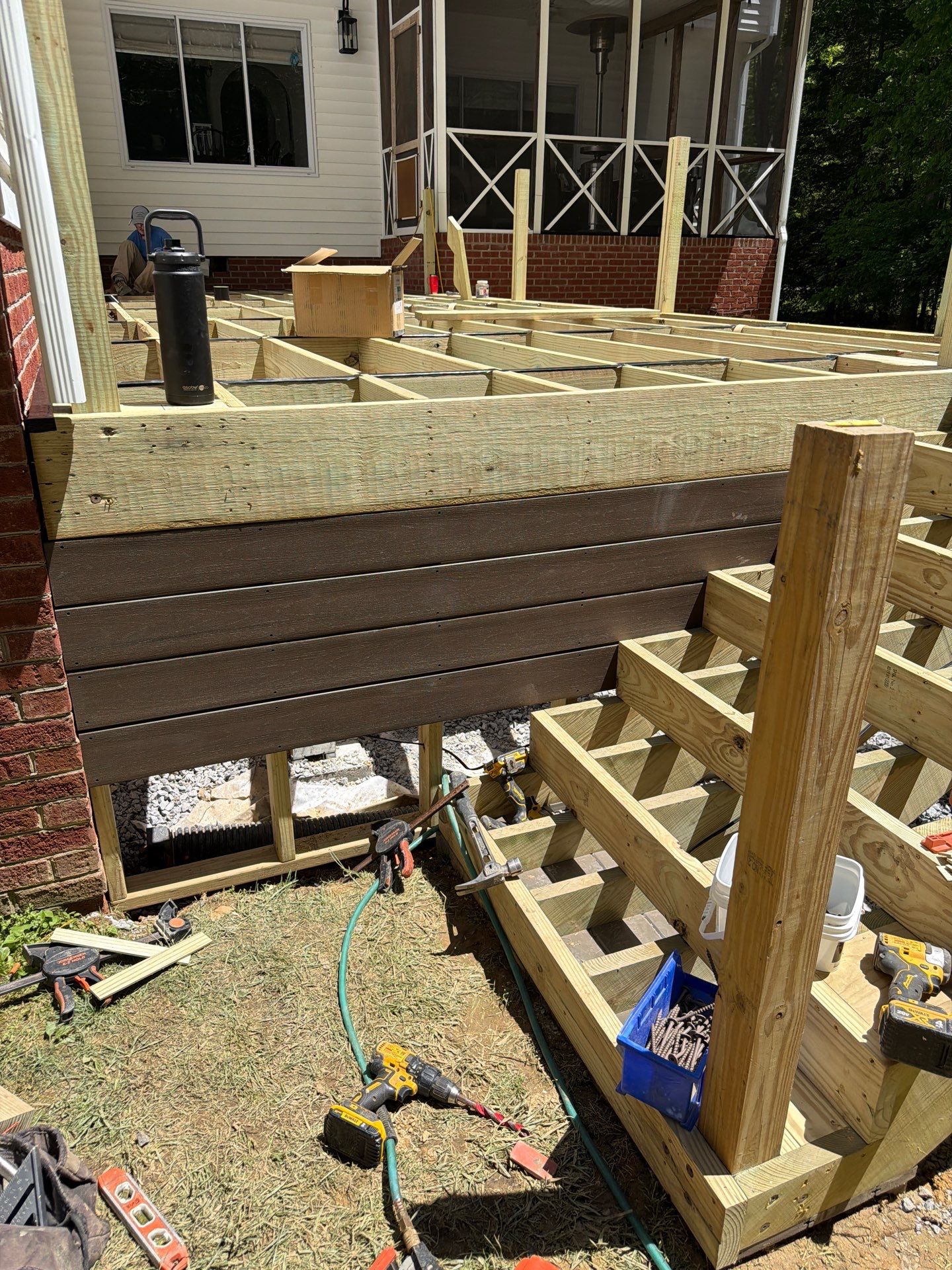 Custom Composite Deck and White Vinyl Railing Installation in Fayetteville by Walnut Hollow Decks & Outdoor Living