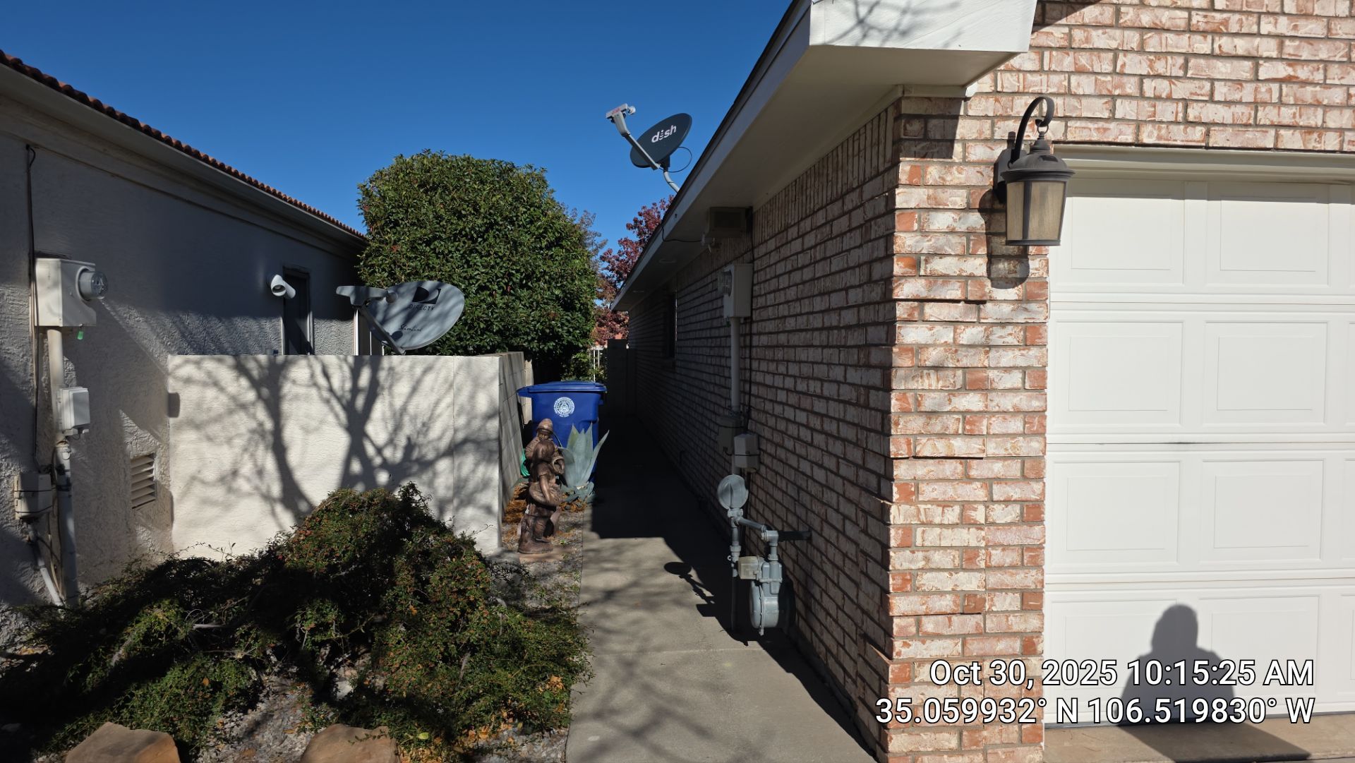 Seamless White Gutter and Downspout Installation in Albuquerque by Doyle Roof Masters Inc