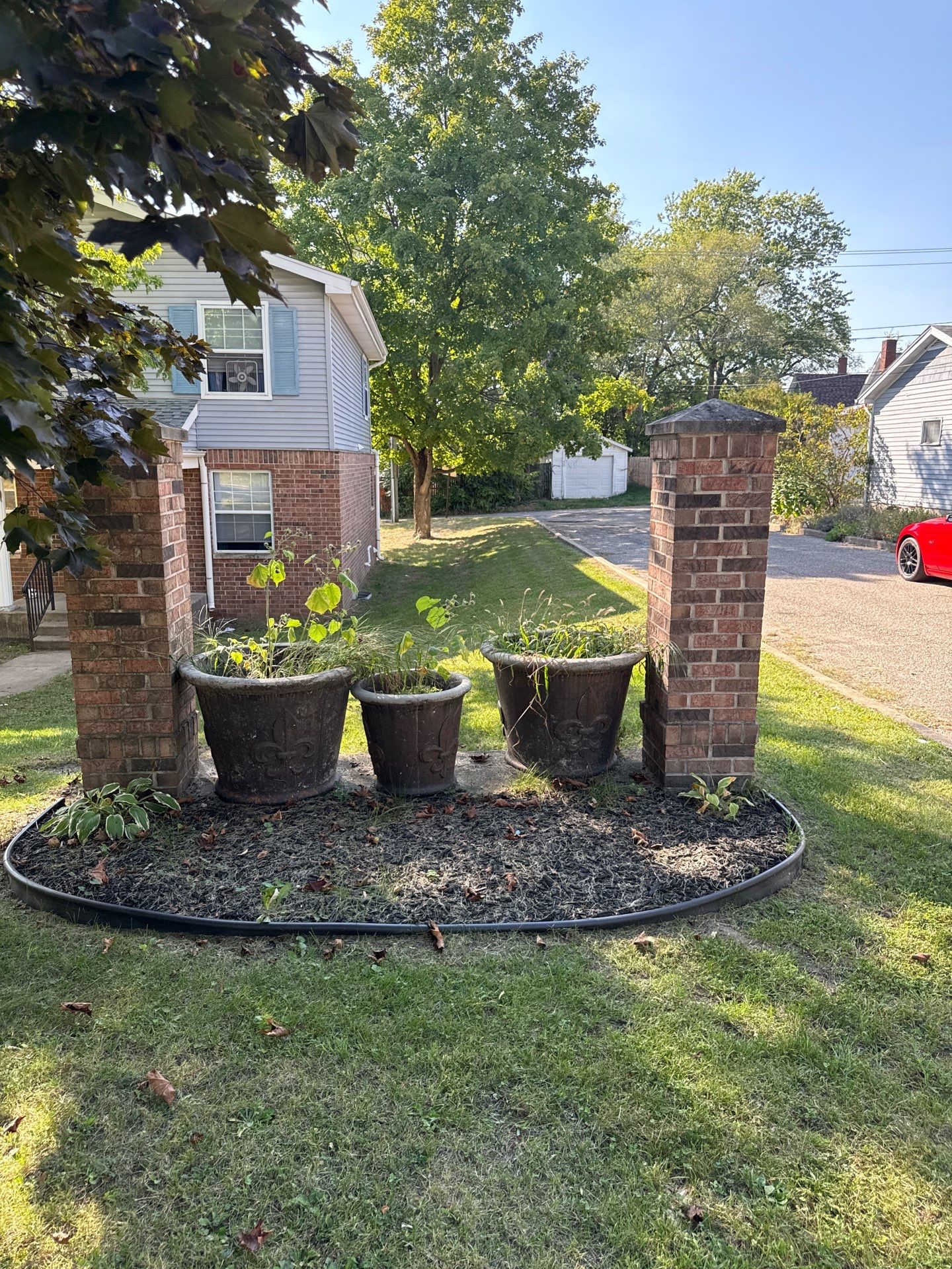 Monument Sign Installation Between Decorative Brick Pillars in South Bend by Hayes Design co