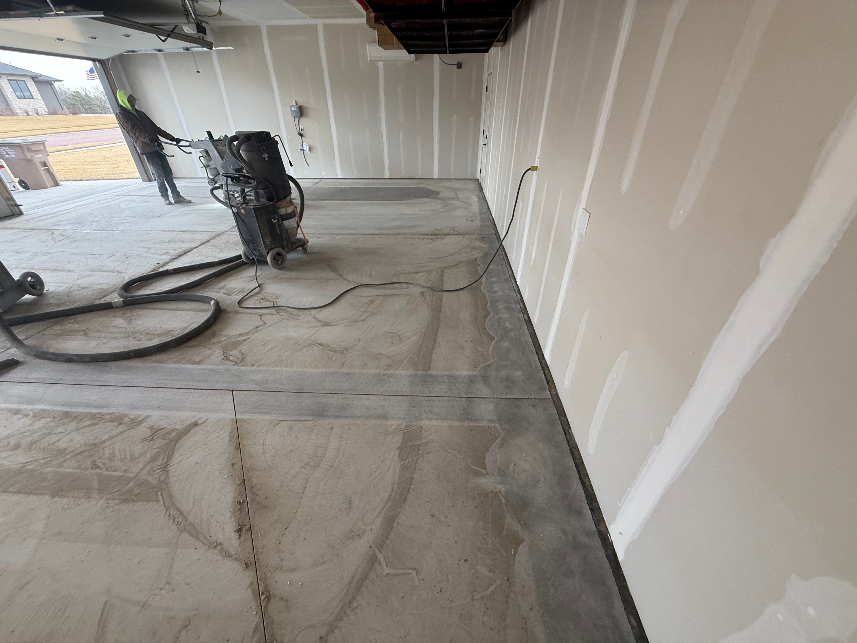 Grey Speckled Epoxy Floor Coating for Sioux Falls Garage by Select Painting, Coatings & Garage Cabinets