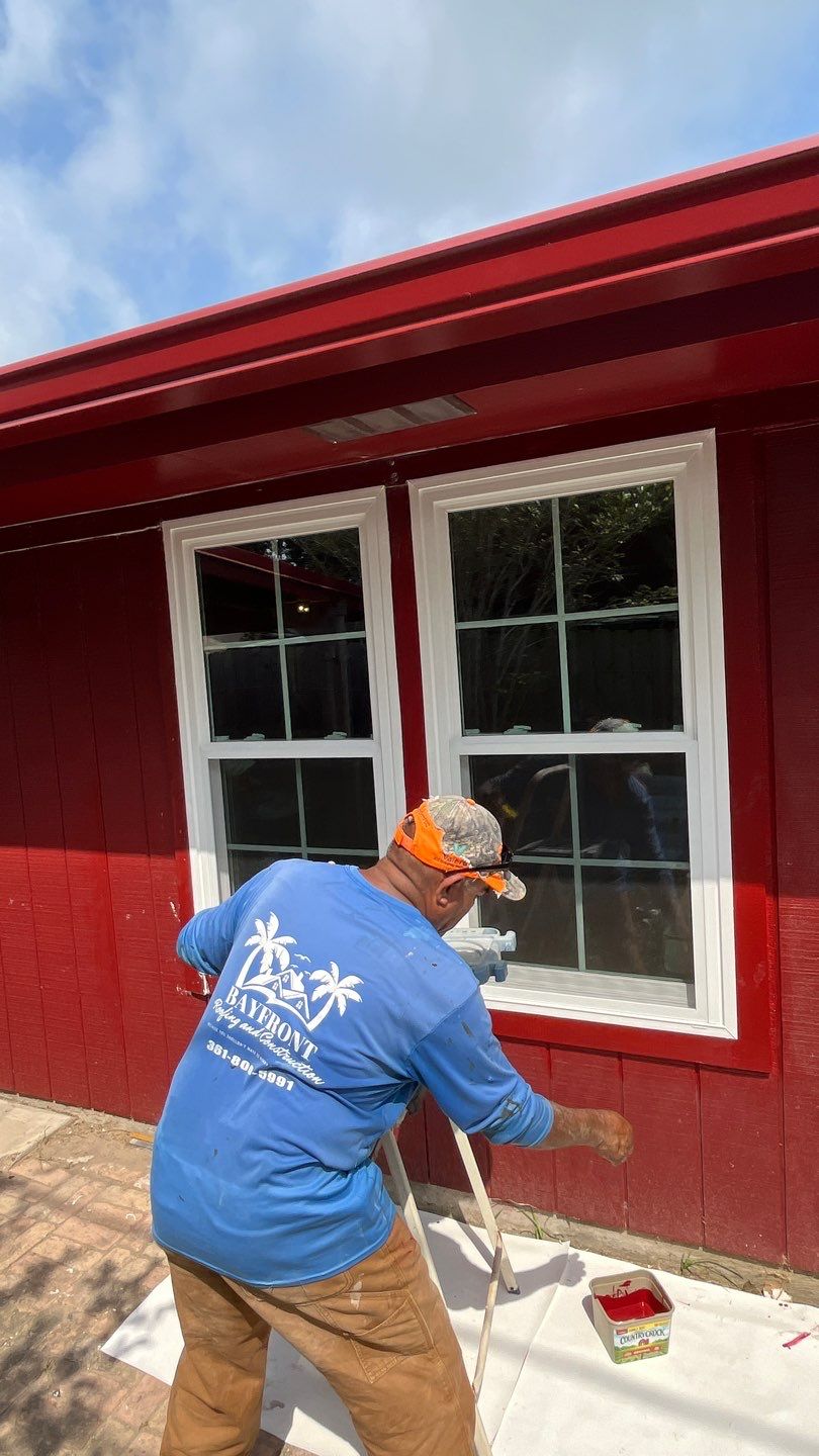 Black and white and red all over by Bayfront Roofing and Construction