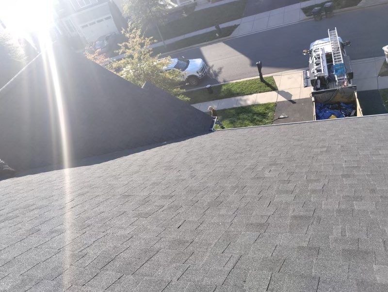 Residential Roofing Installation using Atlas Pinnacle Pristine Black Architectural Shingles by Frederick Roof Repair