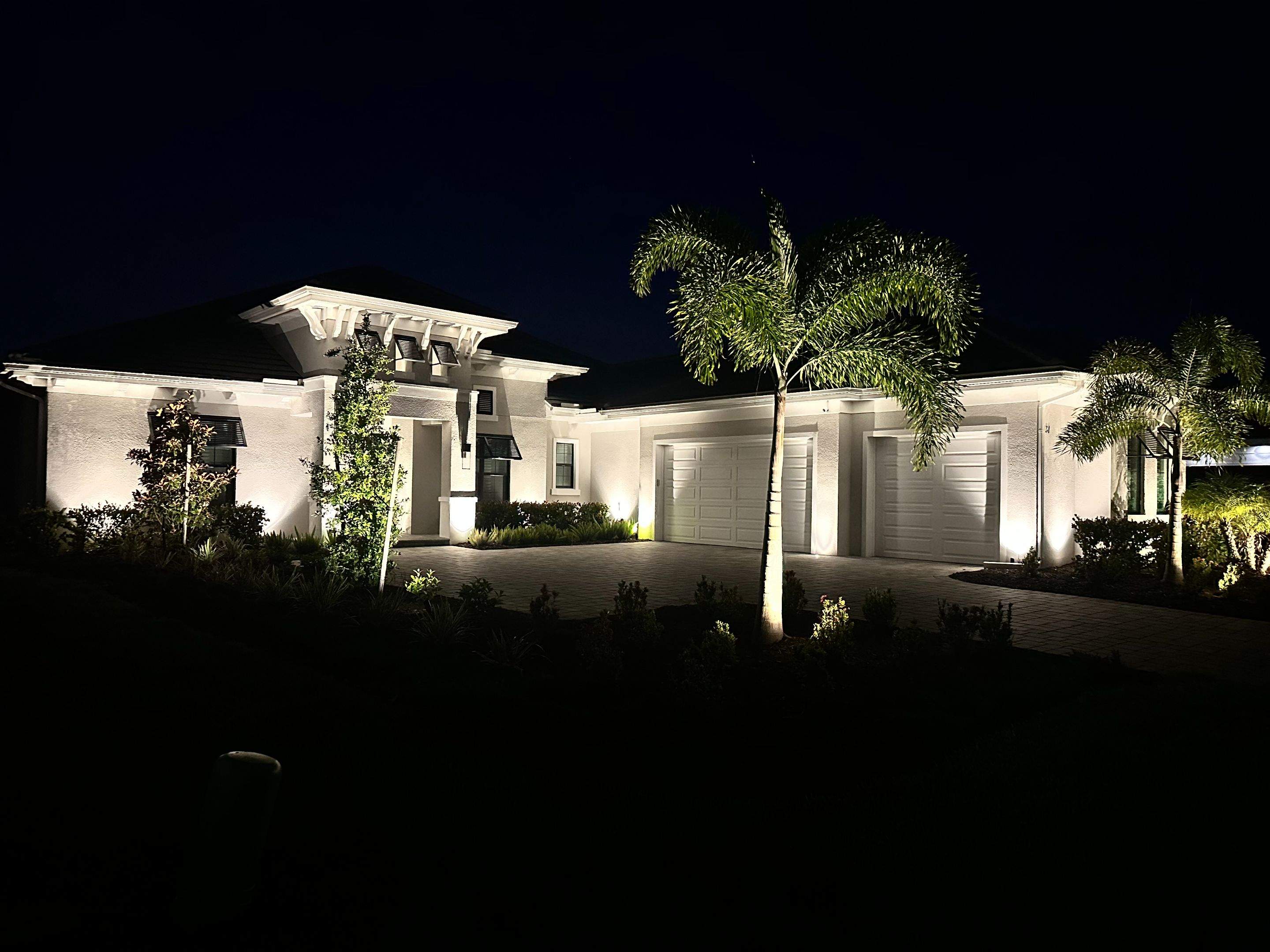 Architectural and Landscape Lighting Installation for Modern Sarasota Home by Illuminate Landscape Designs