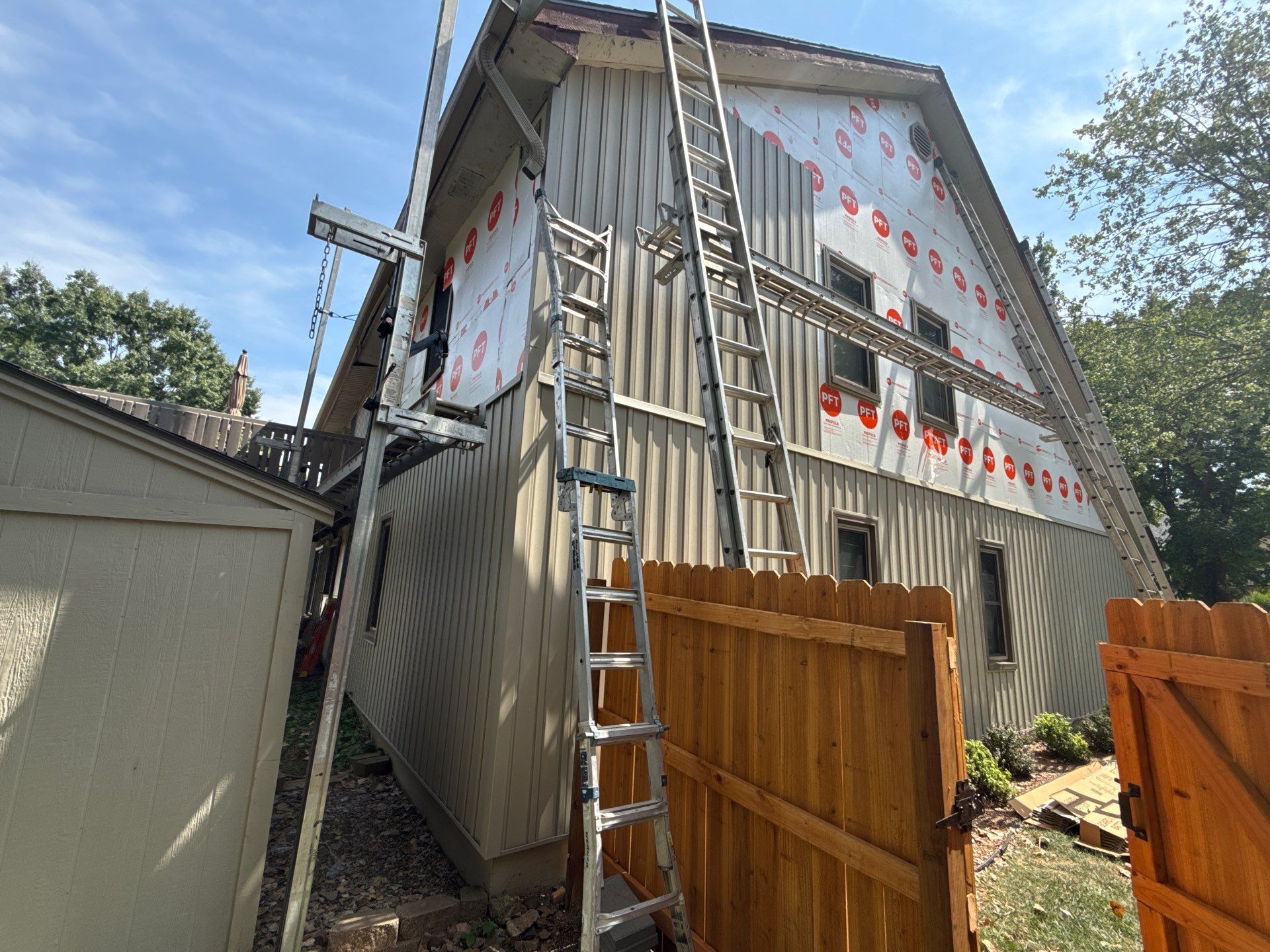Comprehensive Kansas City Exterior Remodel Featuring Board And Batten Siding by EEC Windows, Siding & Roofing