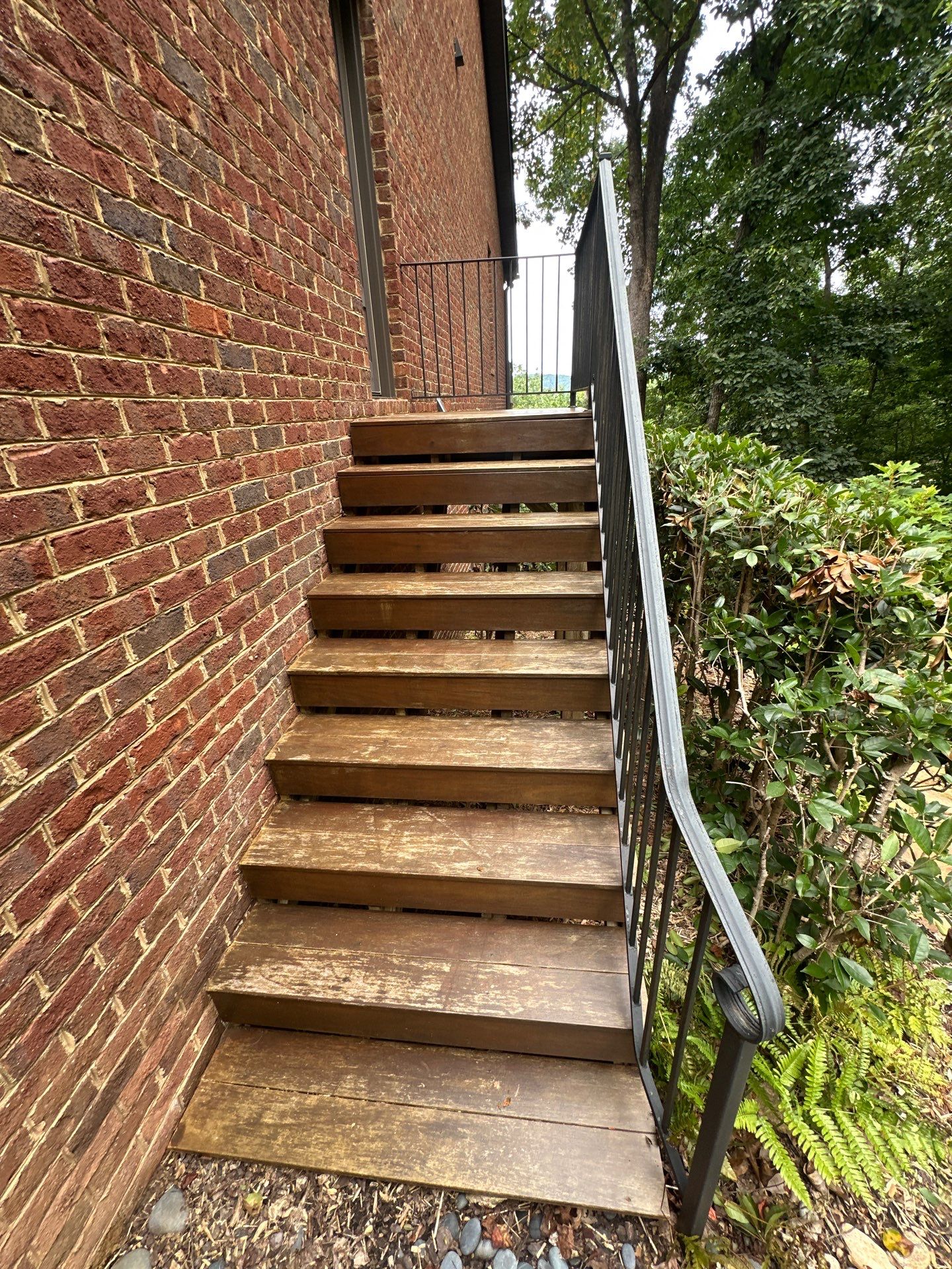 Wood Deck Refinishing and Black Metal Railing Upgrade in Travelers Rest by Painter1