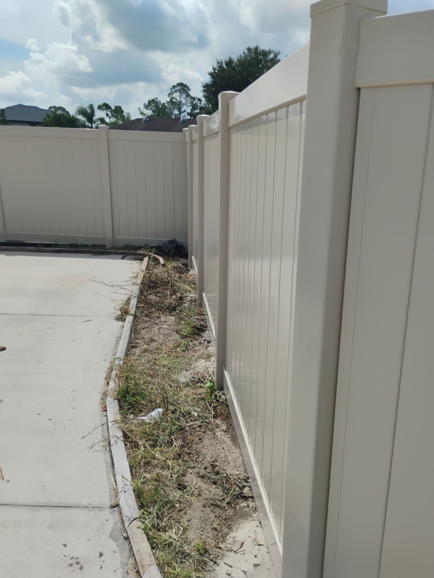 Tan Vinyl Privacy Fence and Gate Installation in North Port by True Fence LLC
