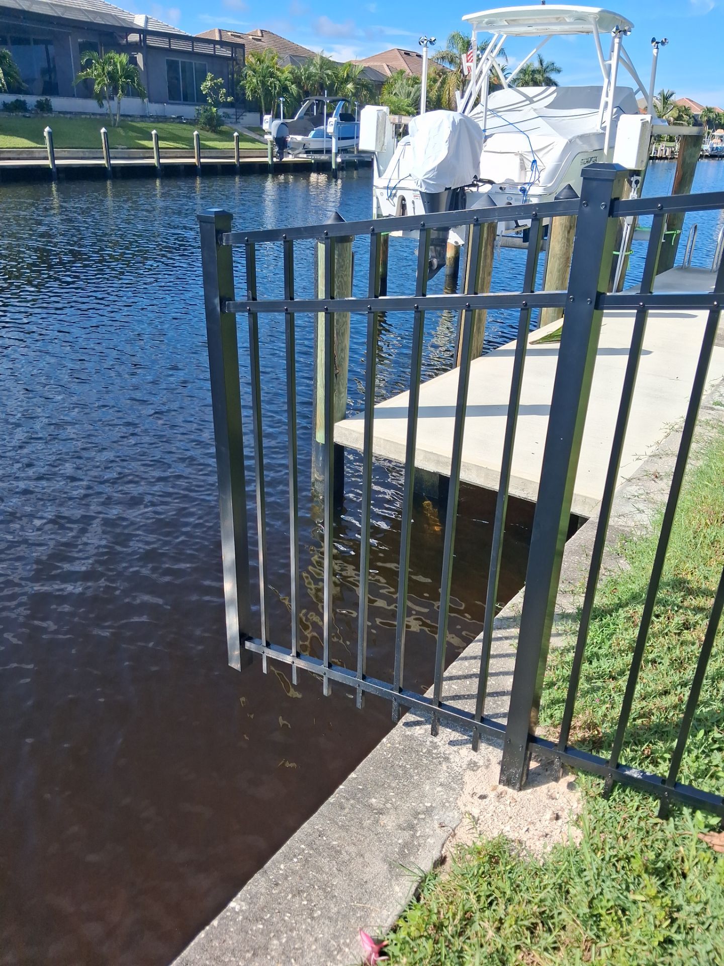 Custom Black Aluminum Fence Enclosure for Punta Gorda Waterfront Property by True Fence LLC