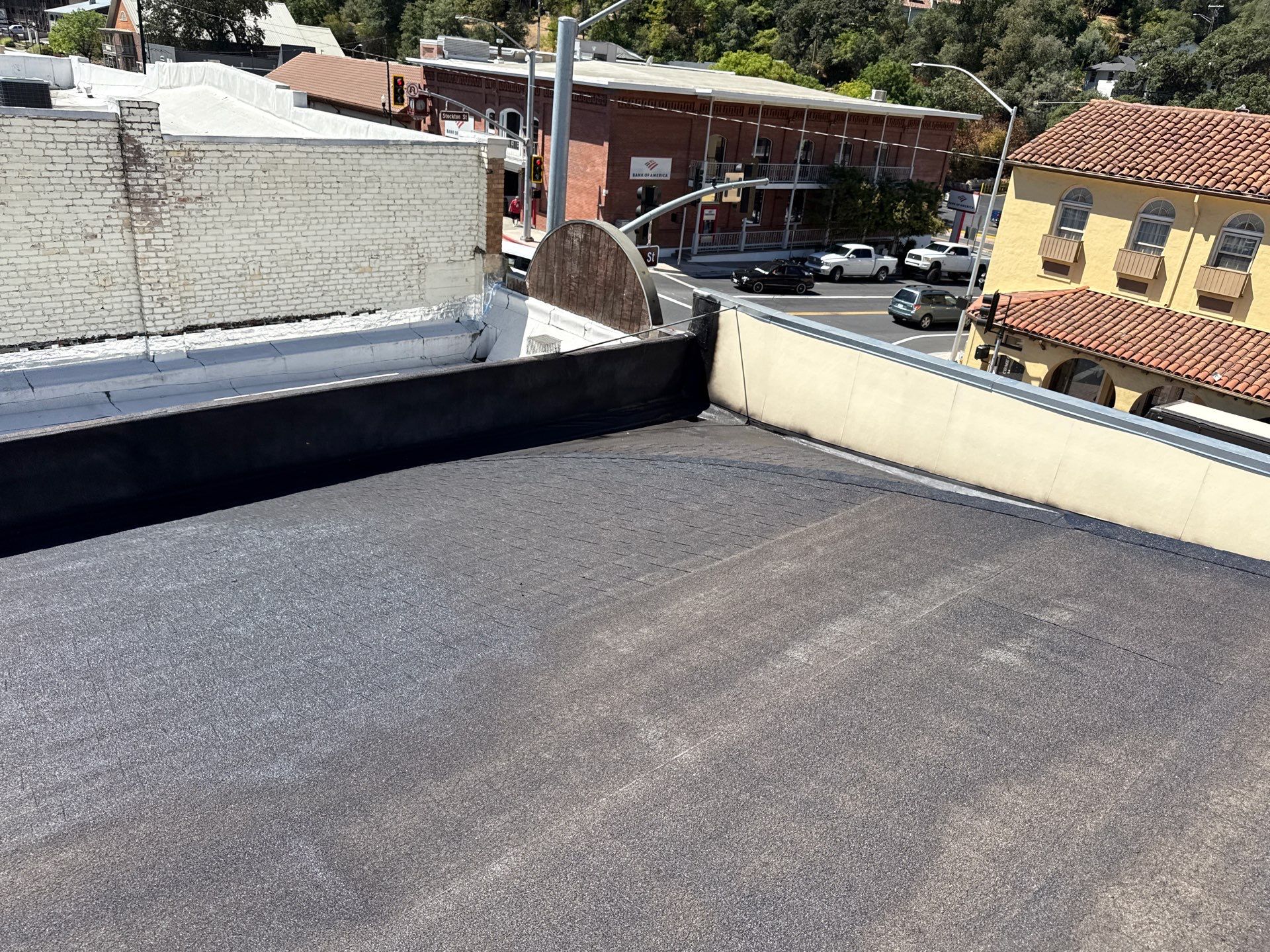 Foam and coatings on commercial roof by Straight Edge Roofing Inc