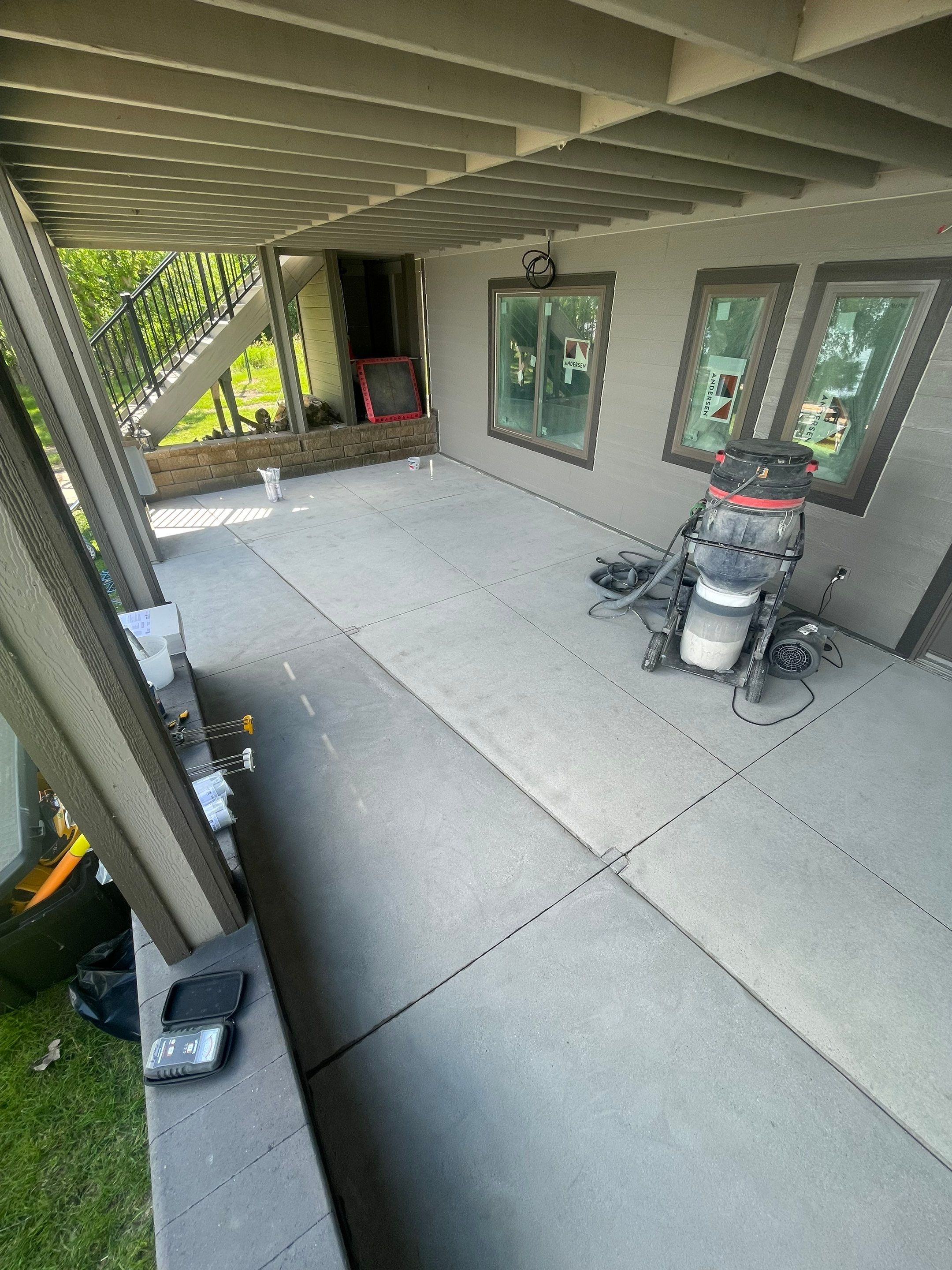 Lakefront Screened Patio Concrete Coating Installation in Wentworth by Select Painting, Coatings & Garage Cabinets