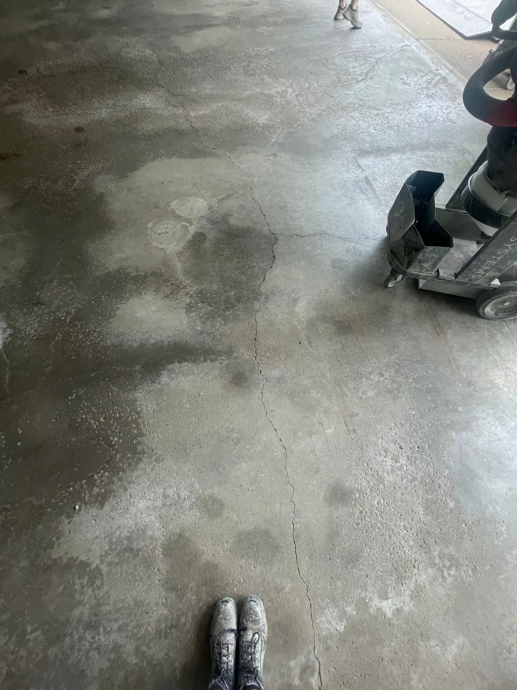 Feather Grey Garage Floor Coating Installation in Sioux Falls by Select Painting, Coatings & Garage Cabinets