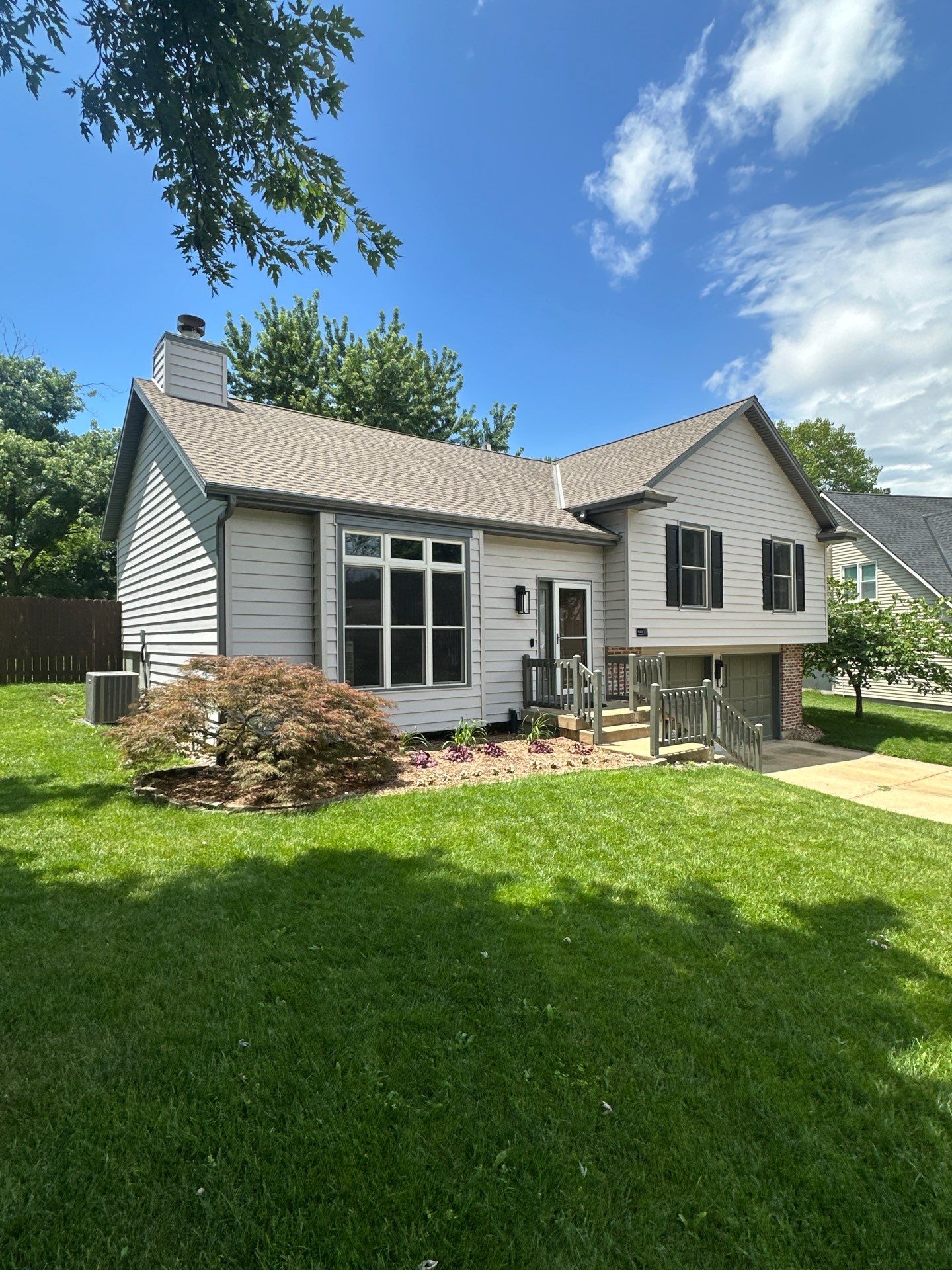 Whole-Home Craneboard Siding Replacement and Exterior Renovation in Shawnee by EEC Windows, Siding & Roofing